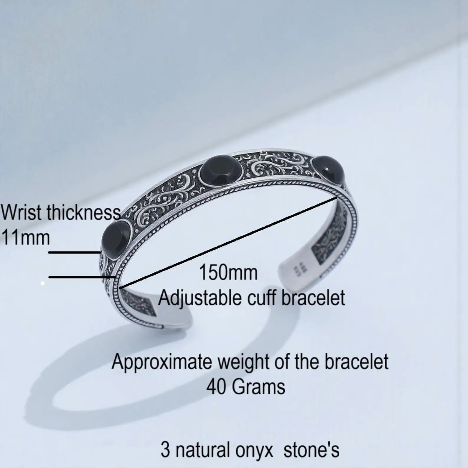 Artisan-made black onyx chunky cuff bracelet for men, featuring a durable 3mm thick sterling silver frame, engraved details, and adjustable fit for a bold and confident style.