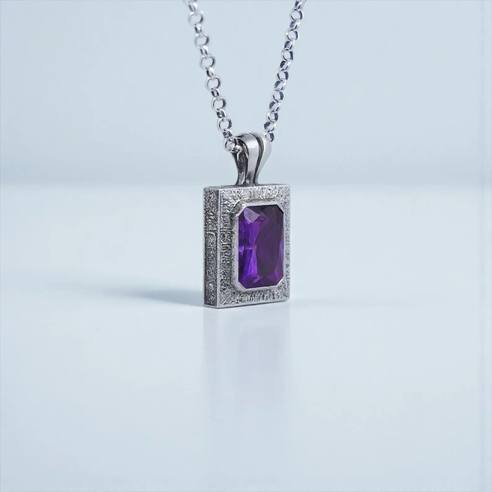 Artisan-made 925 silver amethyst emerald-cut pendant with customizable engraving options, offering calmness, spiritual clarity, and emotional balance.