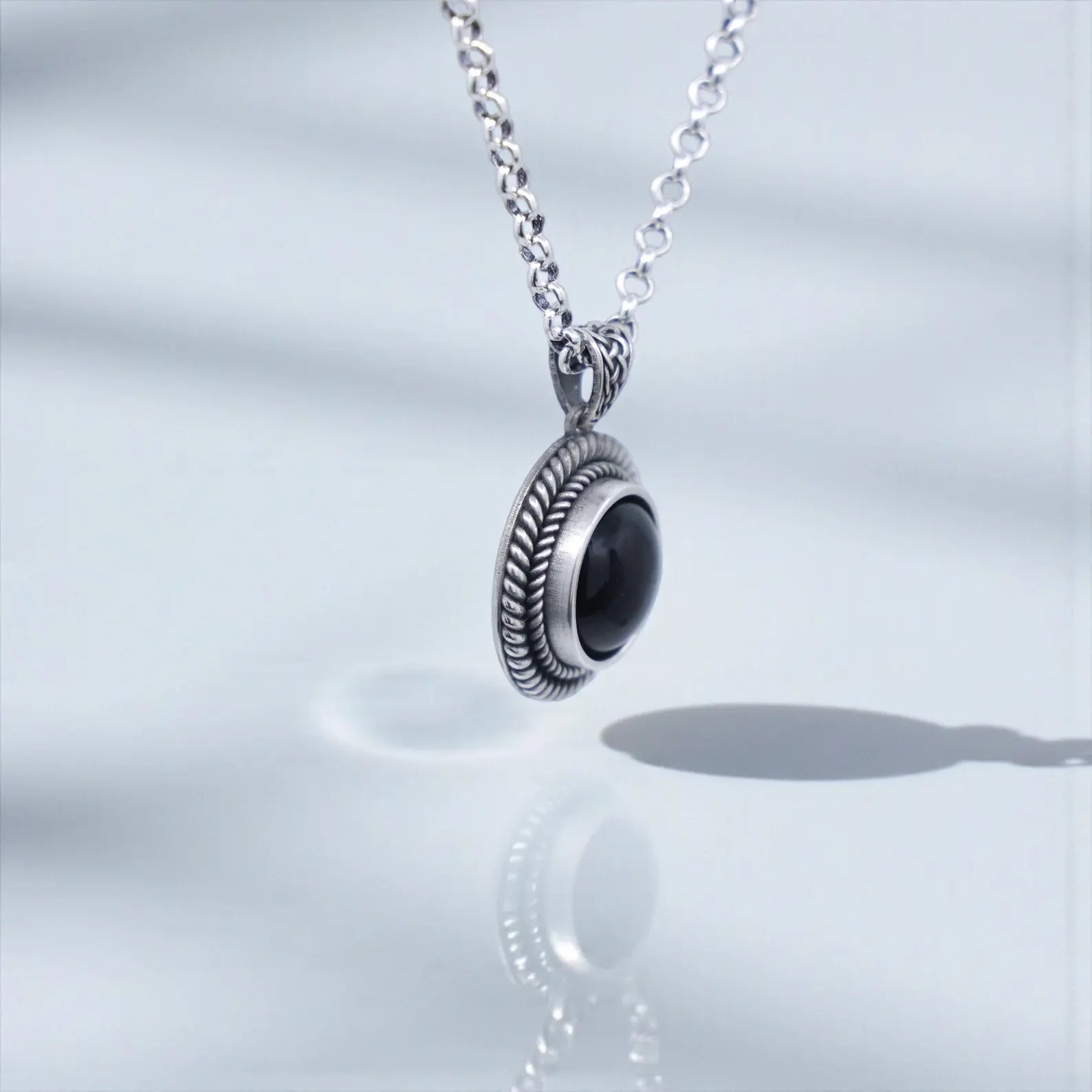 High-quality handcrafted men’s black onyx pendant necklace made from hypoallergenic 925 sterling silver, featuring a masculine chunky rope design suited for stylish, unique, and elegant men’s jewelry lovers.