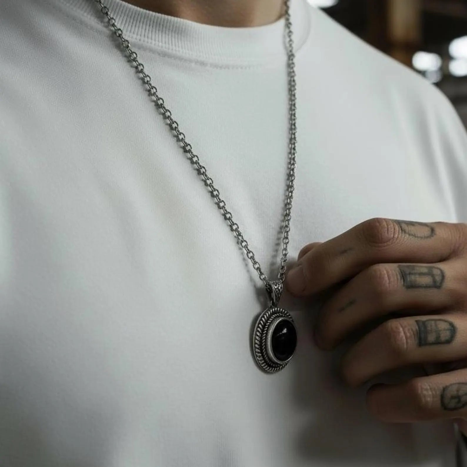 Chunky black onyx sterling silver necklace for men featuring handcrafted rope detailing, a polished vintage design, and a powerful protective gemstone symbolizing strength, grounding, and emotional stability.