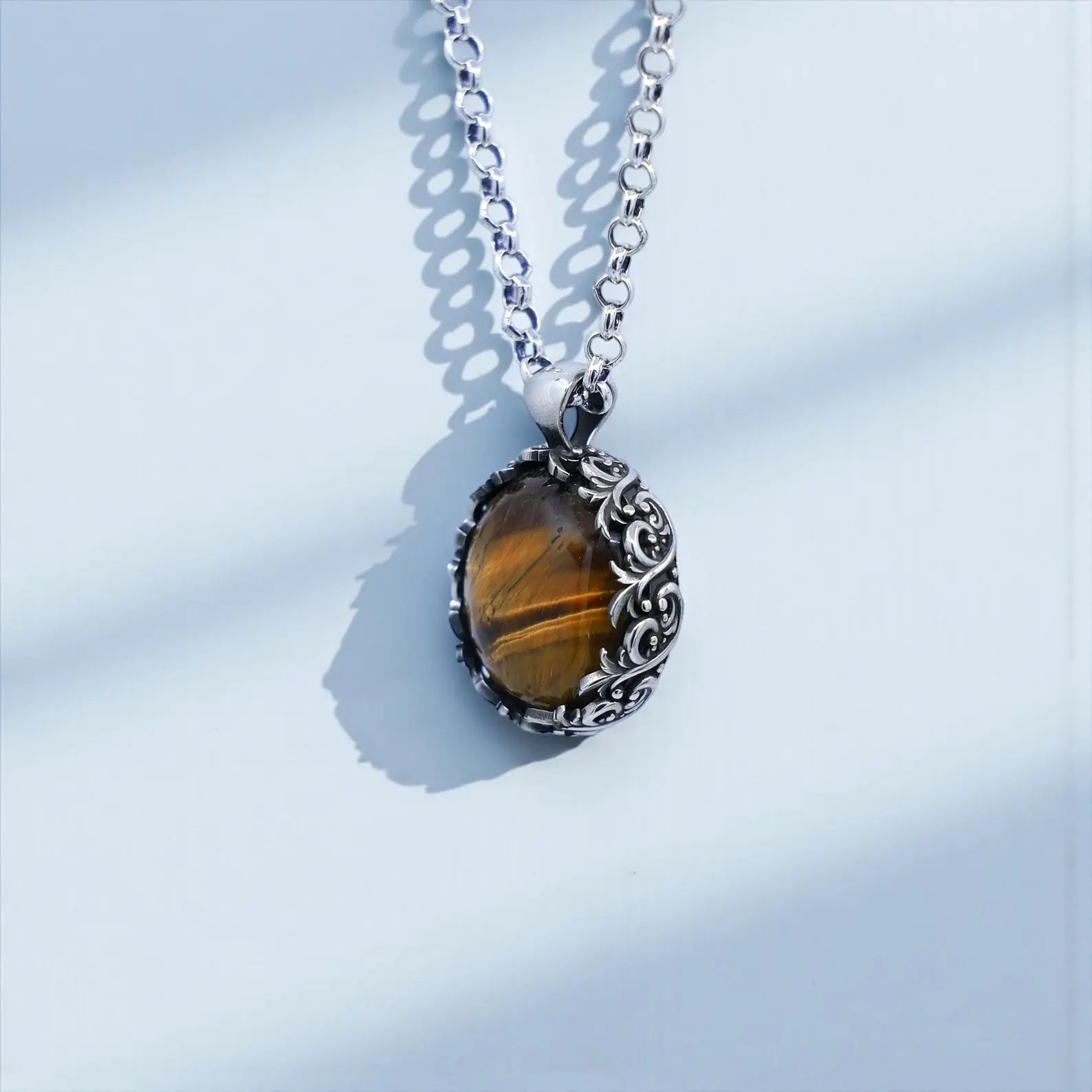Long-lasting handcrafted sterling silver necklace showcasing a real tiger eye gemstone with striking golden tones, surrounded by baroque ornamental silverwork—perfect as a personalized engraved gift for husband, boyfriend, or son.
