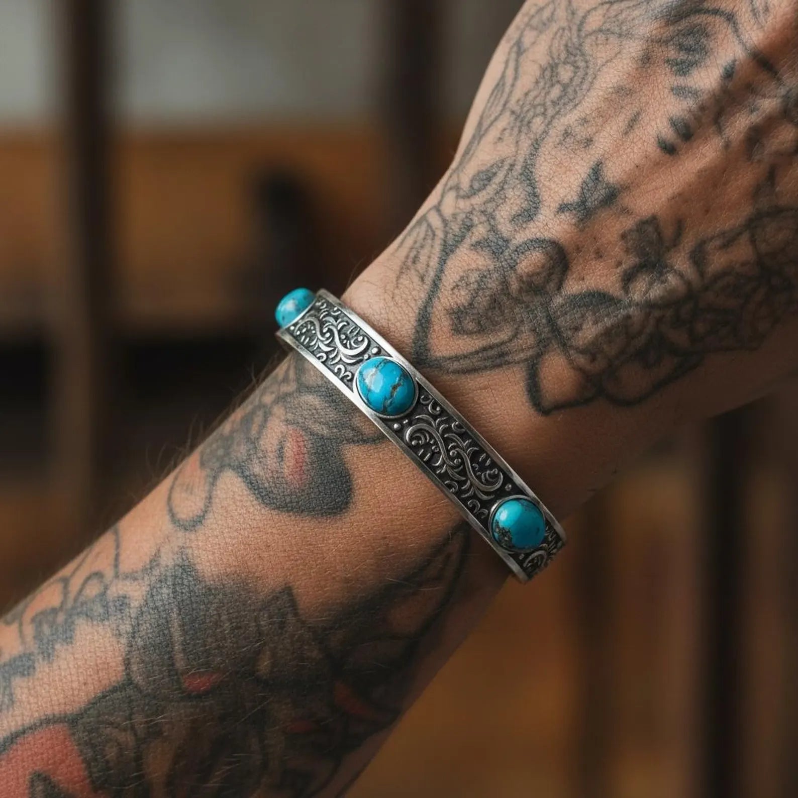 Handcrafted Southwestern turquoise cuff bracelet for men featuring three natural turquoise cabochons set in heavy 925 sterling silver with oxidized Western engravings. Adjustable masculine silver cuff, perfect for boho, biker, and vintage-inspired gemstone jewelry lovers.