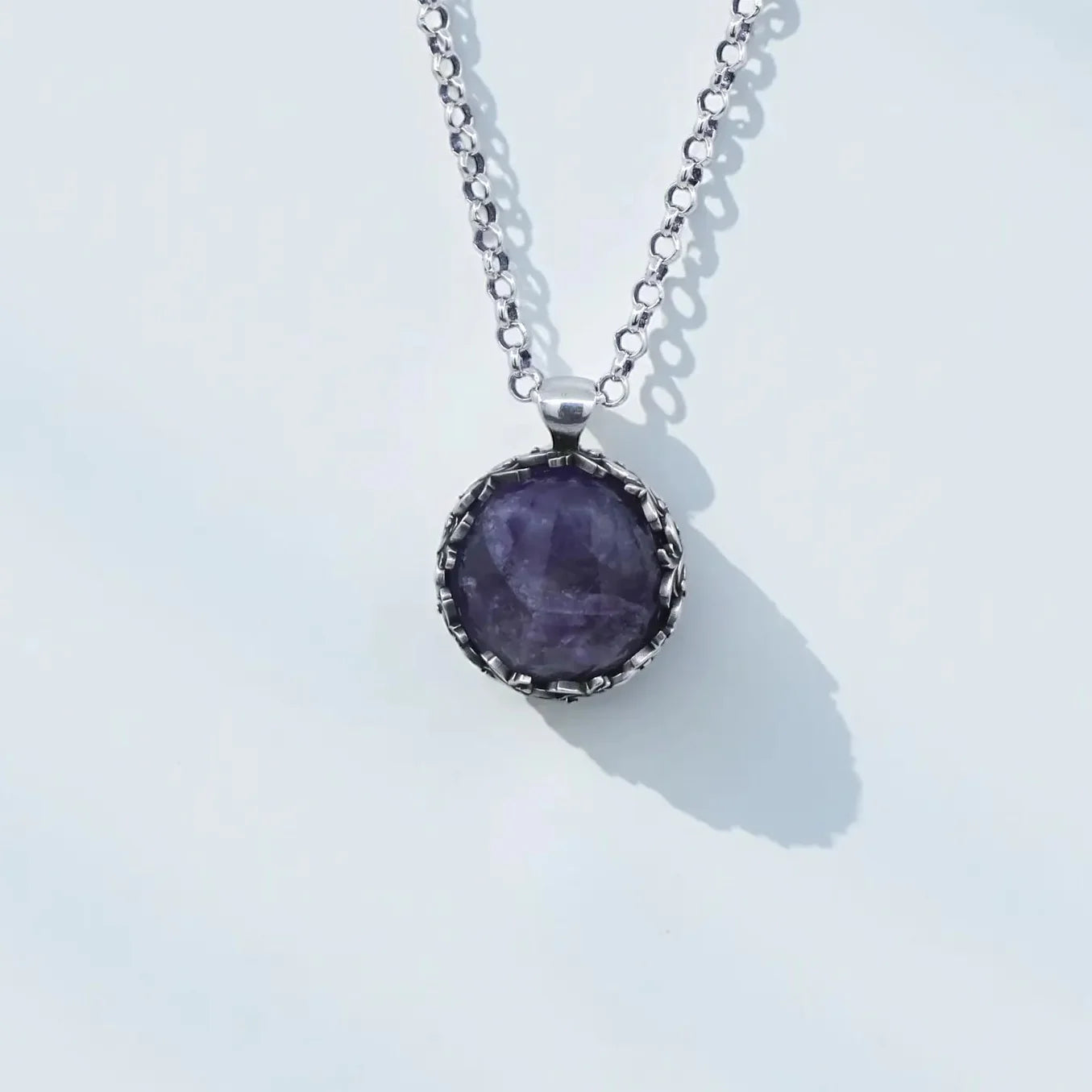 Handcrafted 925 sterling silver amethyst pendant necklace featuring a deep purple natural gemstone in a vintage-inspired baroque leaf design, shown in high-detail close-up with oxidized and hand-polished finish, elegant unisex artisan jewelry.