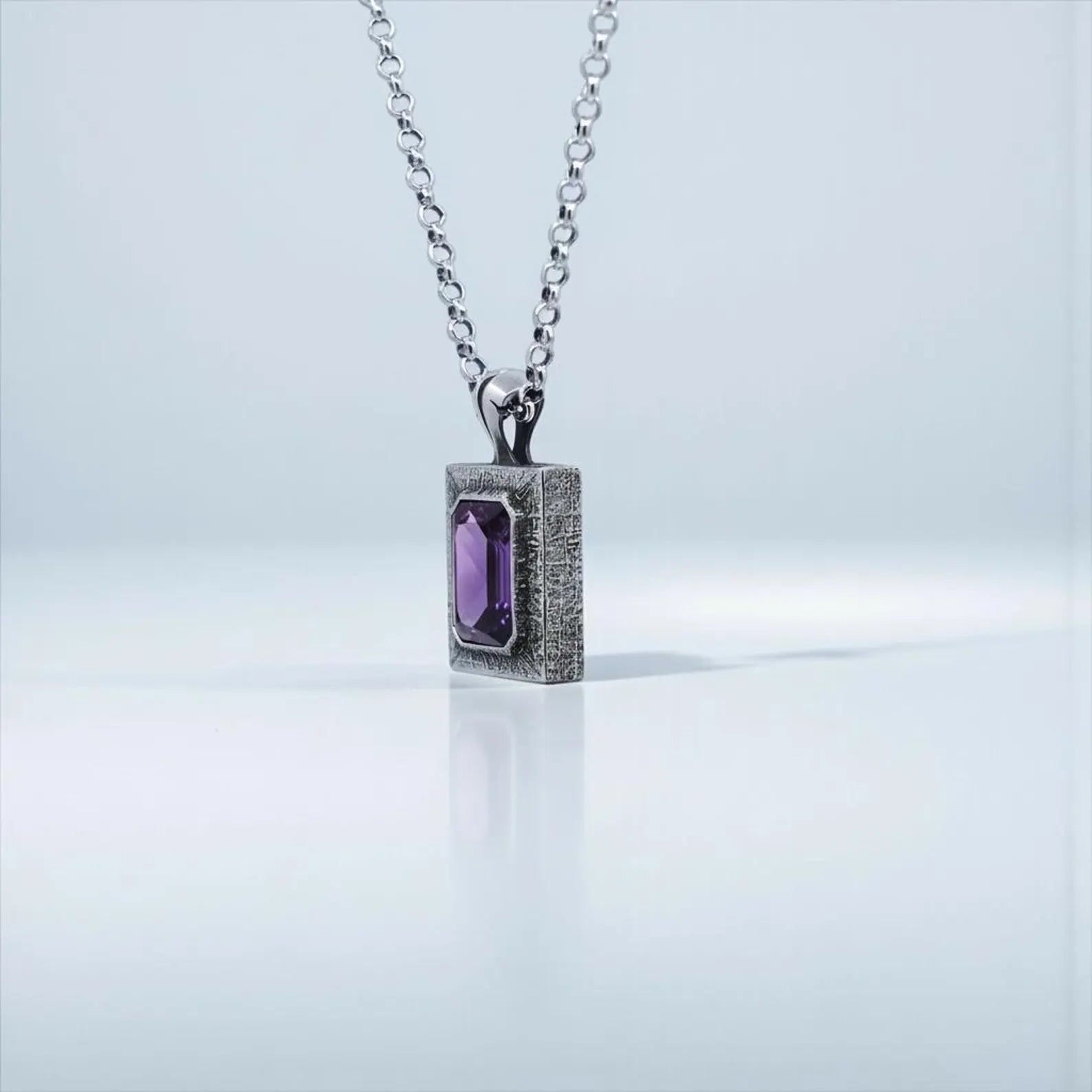 Luxury amethyst gemstone necklace with a large emerald-cut stone set in oxidized 925 silver, designed for birthdays, anniversaries, Christmas, and meaningful personalized gifting.