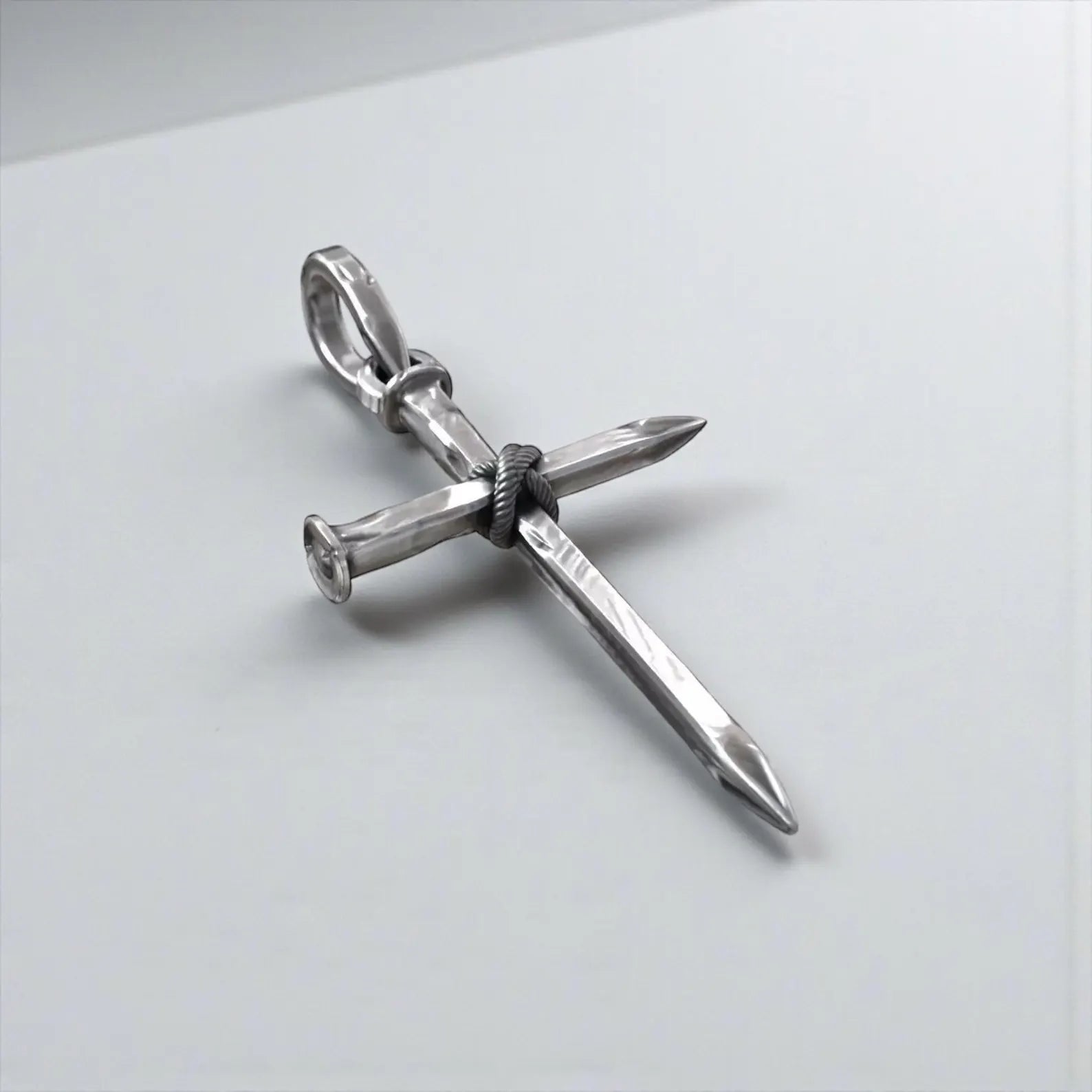 Men’s sterling silver nail cross necklace showcasing detailed craftsmanship, symbolic Christian cross design, and bold masculine faith jewelry style.