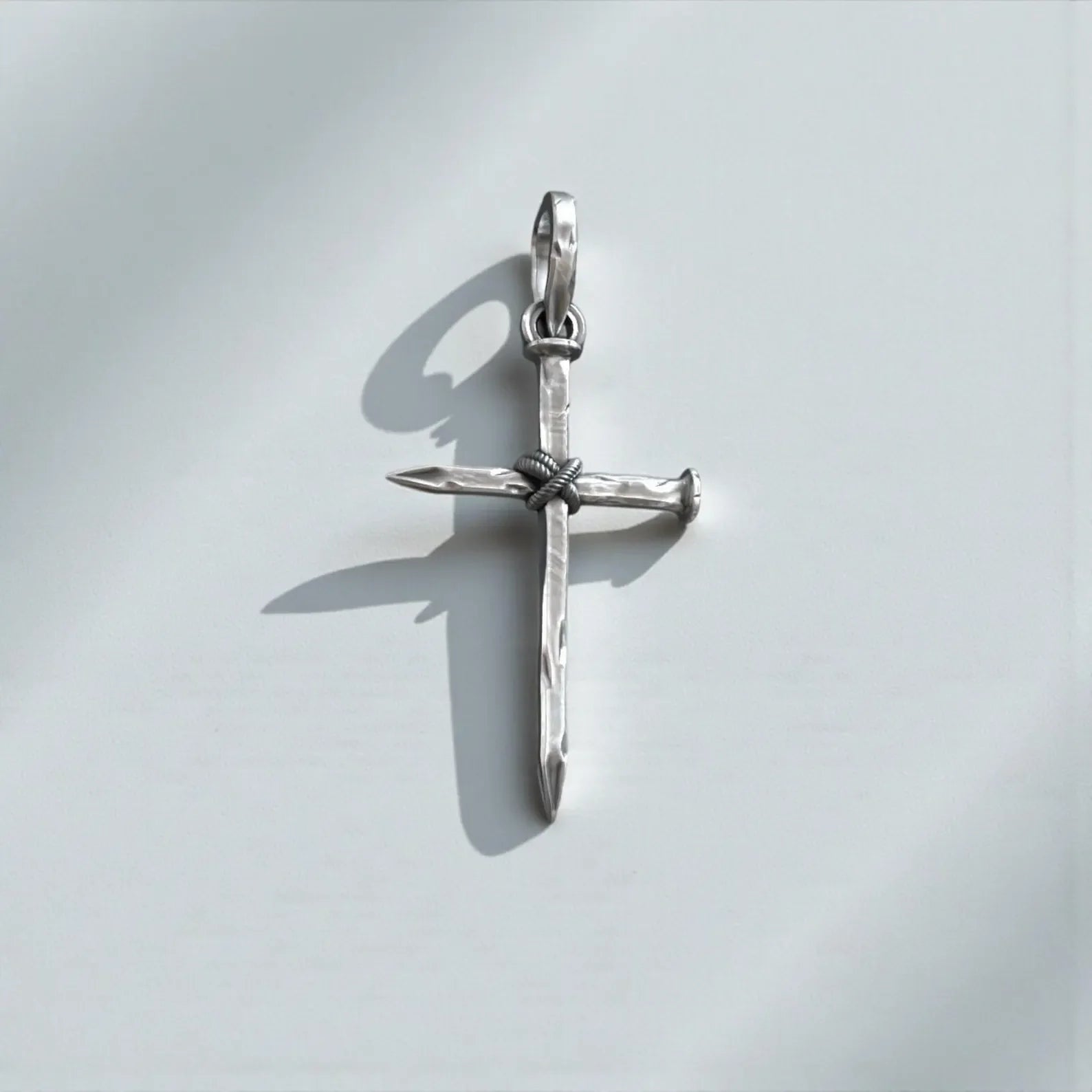 Sterling silver nail cross pendant for men crafted from 925 sterling silver, featuring a bold gothic Christian design that symbolizes faith, devotion, and spiritual strength.