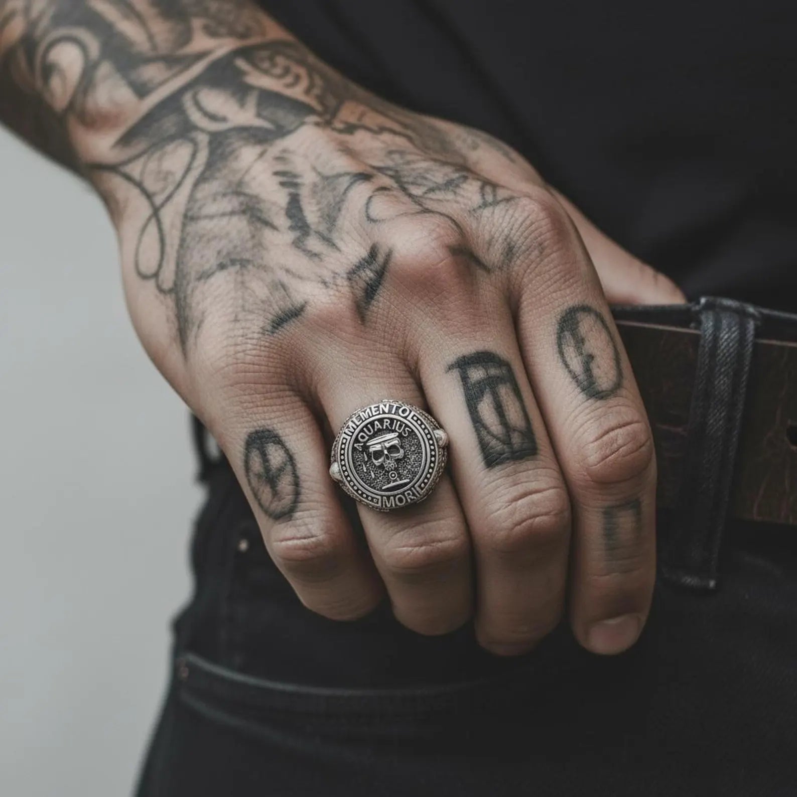 Handcrafted Aquarius zodiac ring in sterling silver with a detailed skull motif, inspired by Memento Mori philosophy and astrological symbolism for men who value meaning and style.