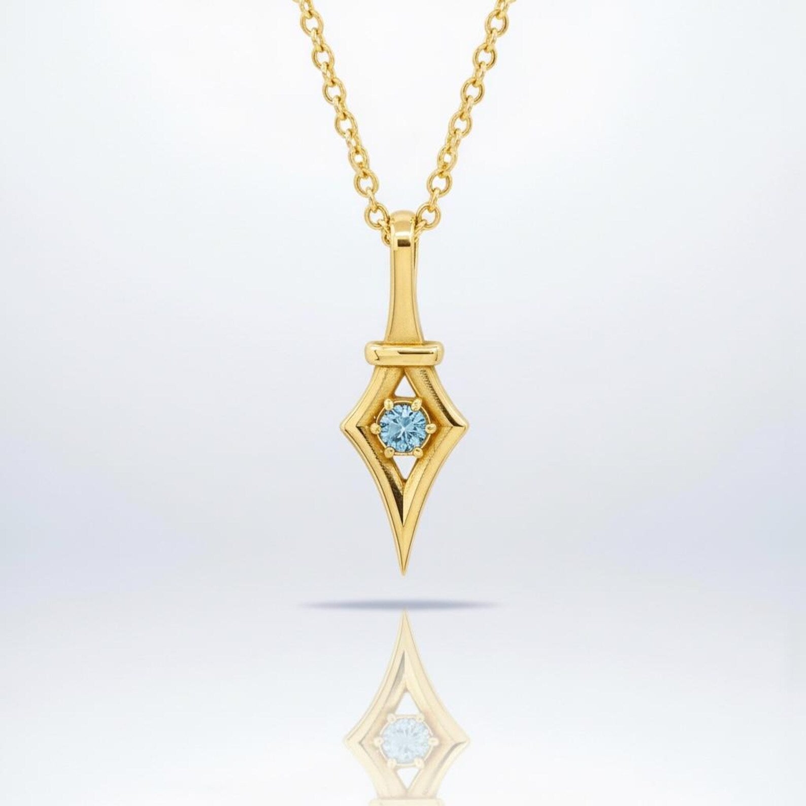 Minimalist 18K gold plated aquamarine pendant necklace crafted from 925 sterling silver, featuring a luminous light blue aquamarine birthstone gemstone in a clean and elegant pendant design