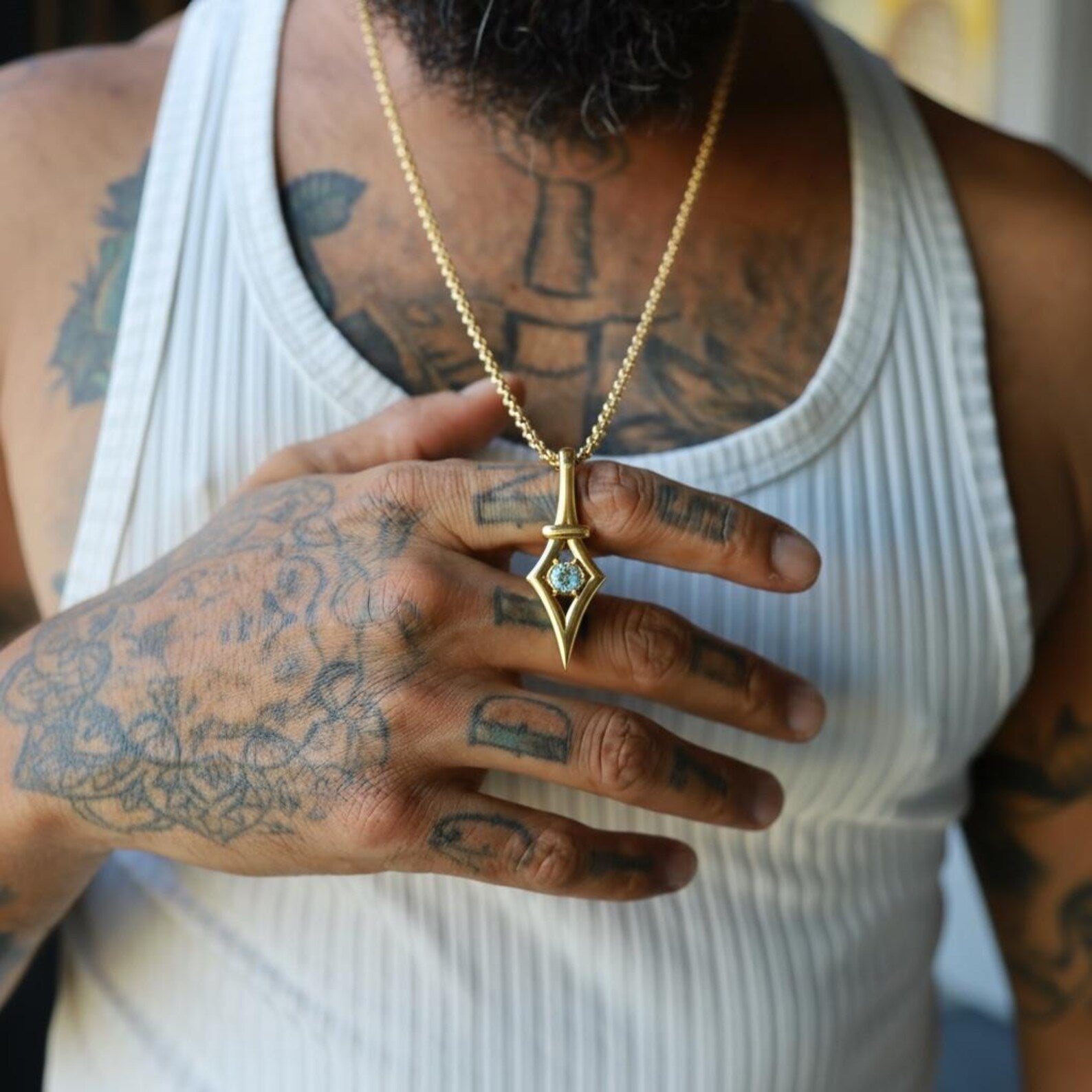 Minimalist aquamarine necklace inspired by calm ocean tones, featuring a light blue aquamarine gemstone set in handcrafted gold plated sterling silver pendant