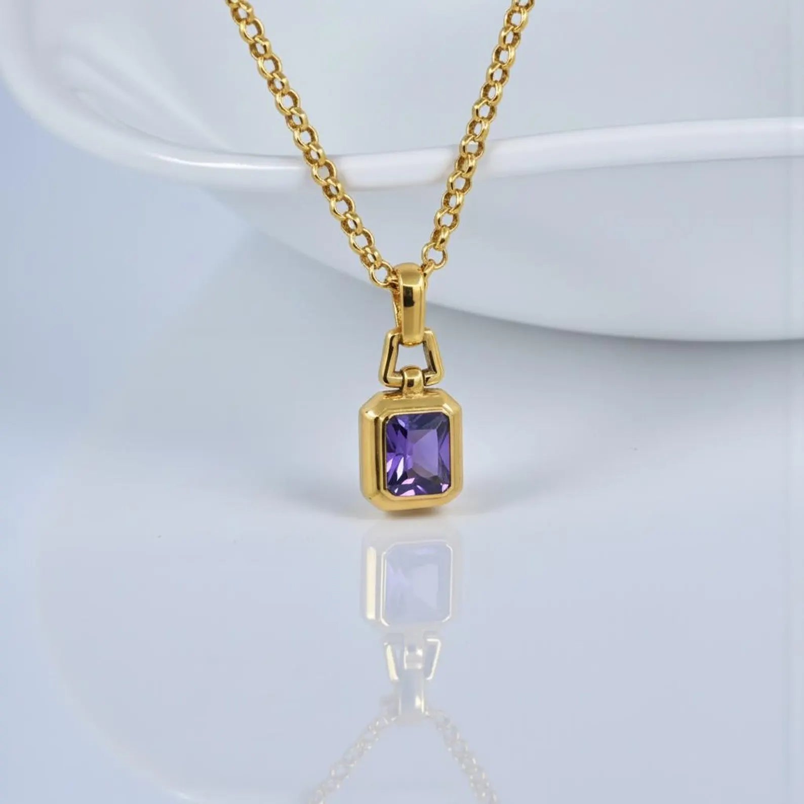 Luxury 18K gold plated amethyst gemstone pendant necklace crafted from solid 925 sterling silver, featuring a rich violet oval-cut amethyst stone on a minimalist unisex chain, photographed in high-detail studio lighting