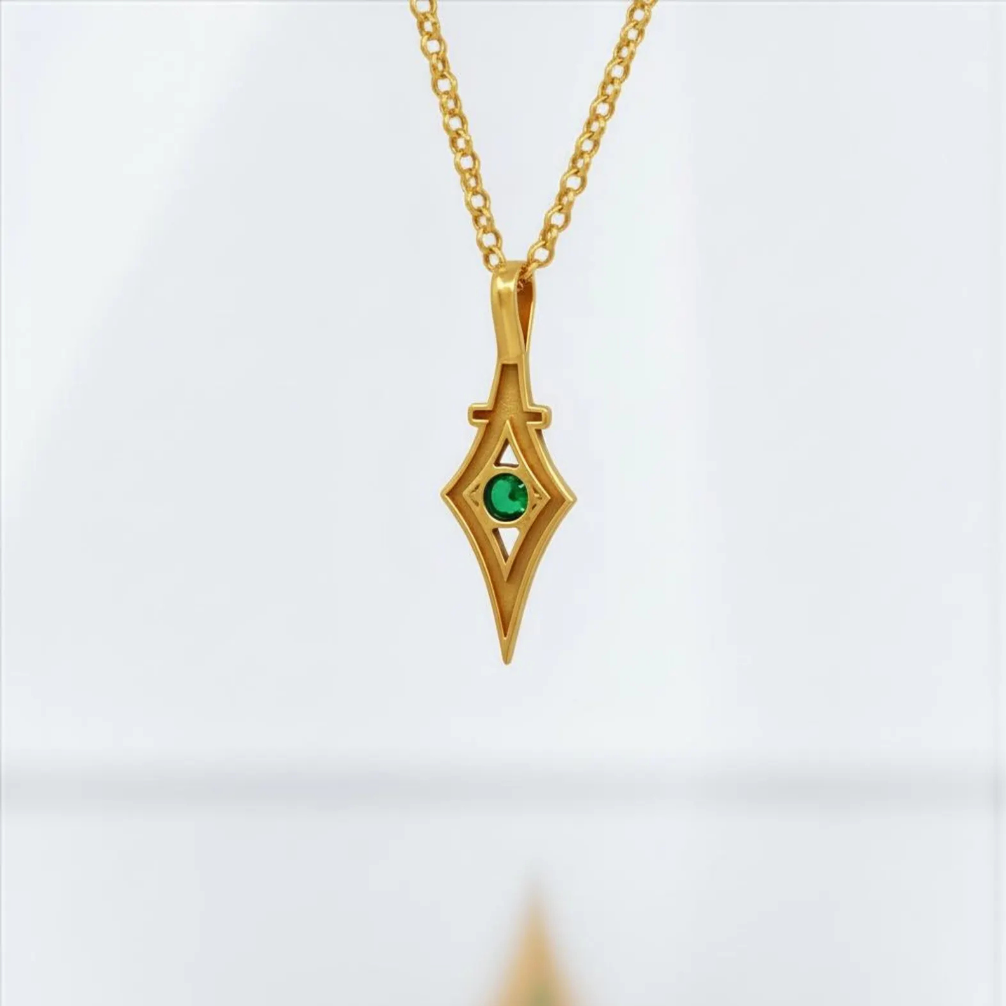 Dark romantic emerald pendant necklace crafted in Victorian gothic style, featuring gold plated sterling silver and green gemstone