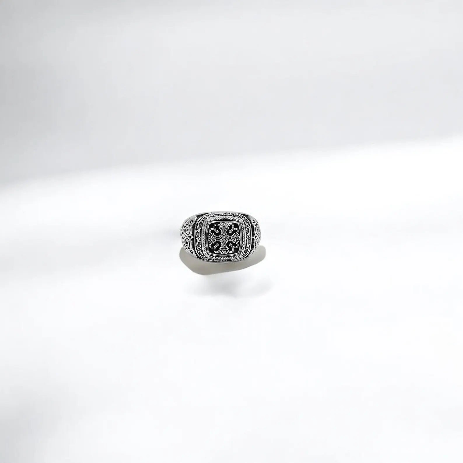 A powerful statement piece with spiritual depth, this engraved sterling silver ring showcases a gothic cross framed by intricate bohemian patterns. Perfect for men who value faith, heritage, and refined craftsmanship in their accessories.