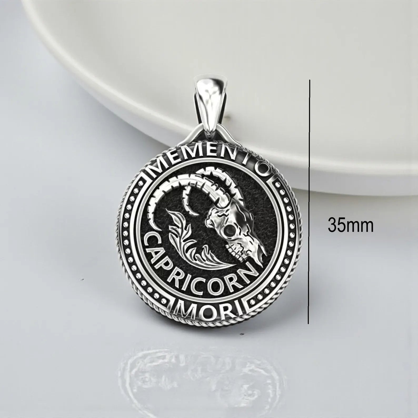 Vintage inspired Capricorn zodiac pendant necklace with Sea-Goat symbol, highlighting gothic engravings, celestial meaning and handcrafted silver artistry