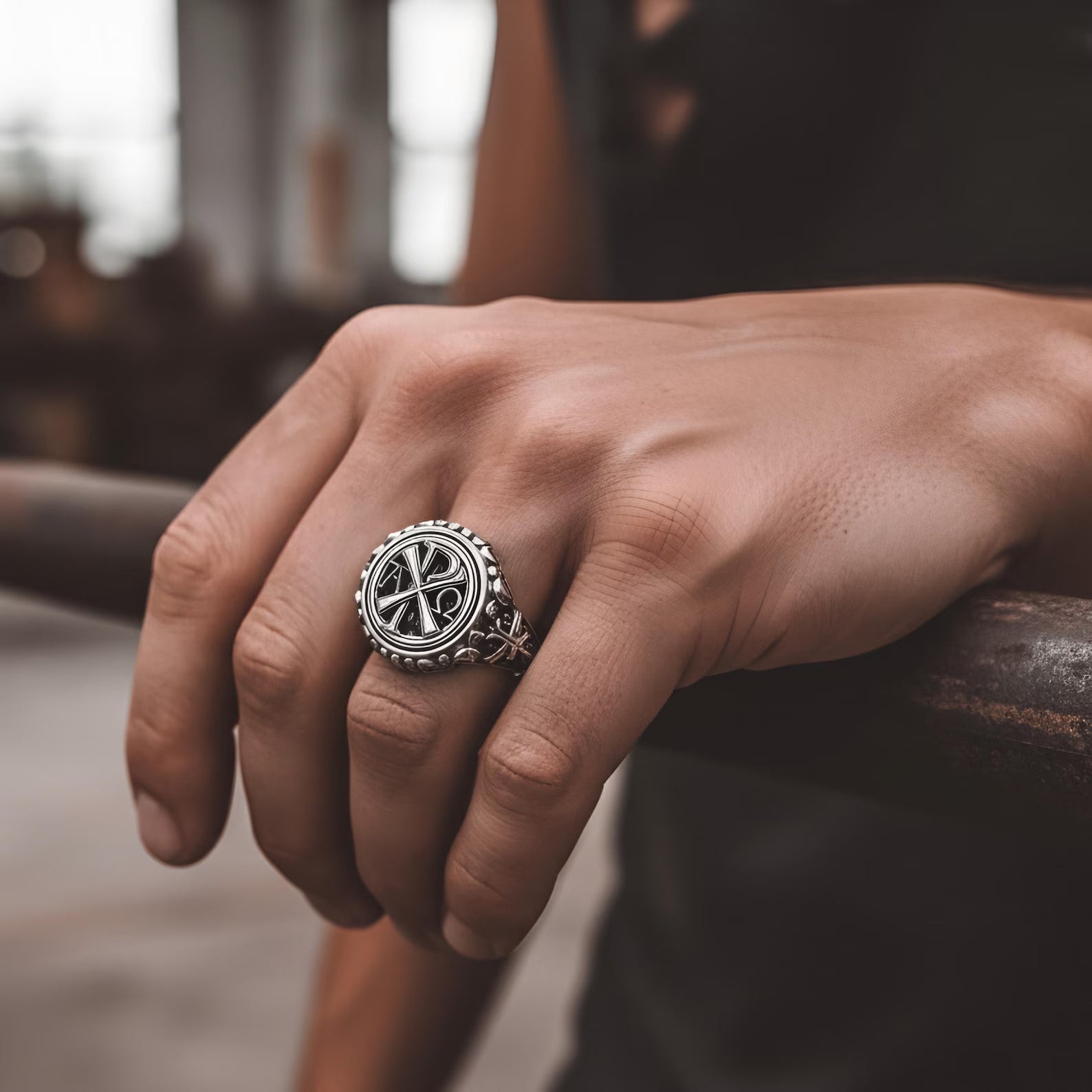 Close-up of a sterling silver Chi Rho Alpha and Omega ring showing engraved Jesus Christ monogram, detailed sacred patterns and handcrafted religious jewelry craftsmanship