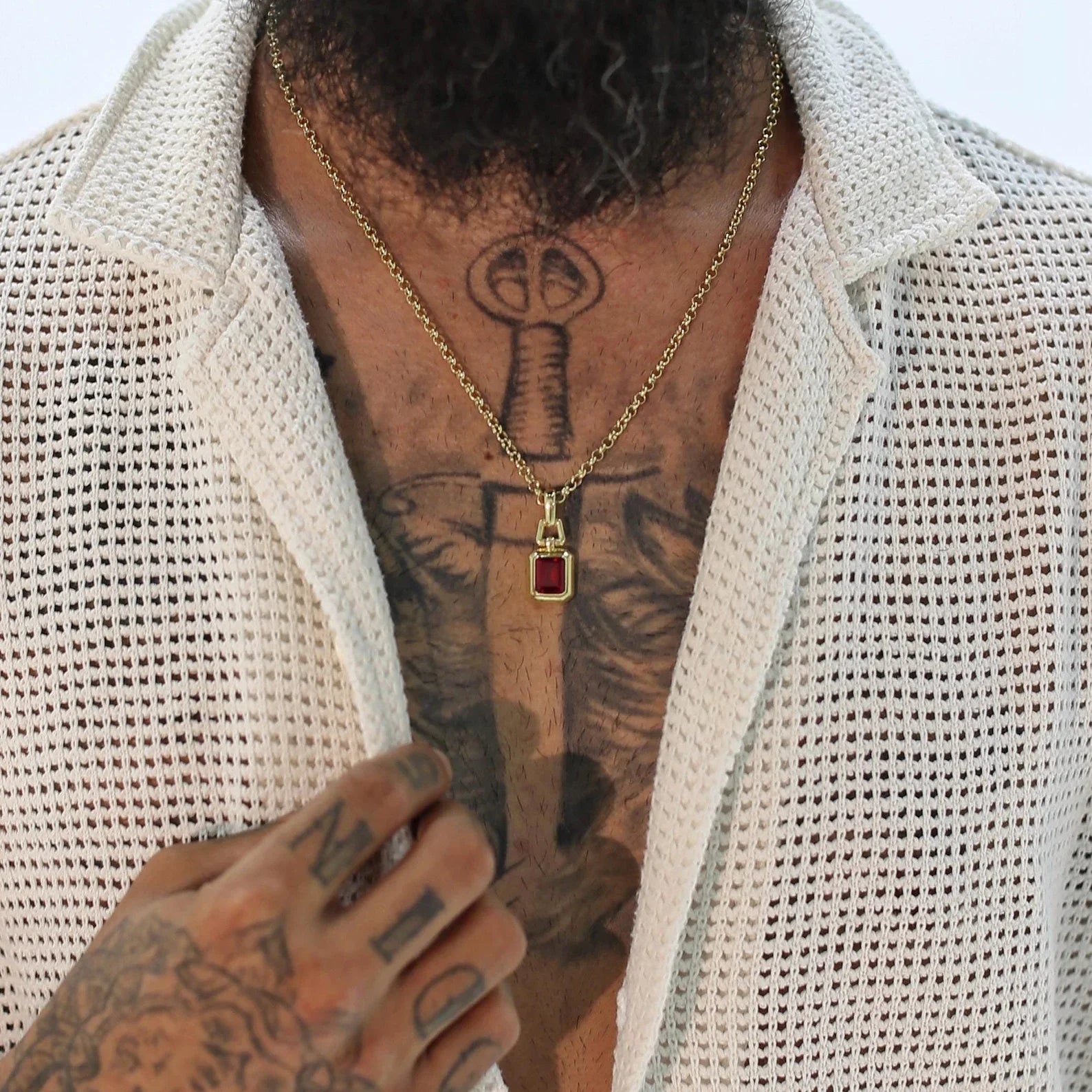 Luxurious lab ruby gemstone necklace handcrafted in 14k gold-plated sterling silver with a bold emerald-inspired hue. Designed for those who value artistic detail and vintage-inspired elegance. The thick, durable chain and detailed emerald cut give this unisex pendant a timeless feel. Perfect for gift-giving or enhancing your personal jewelry collection with an ethnic, sophisticated flair.