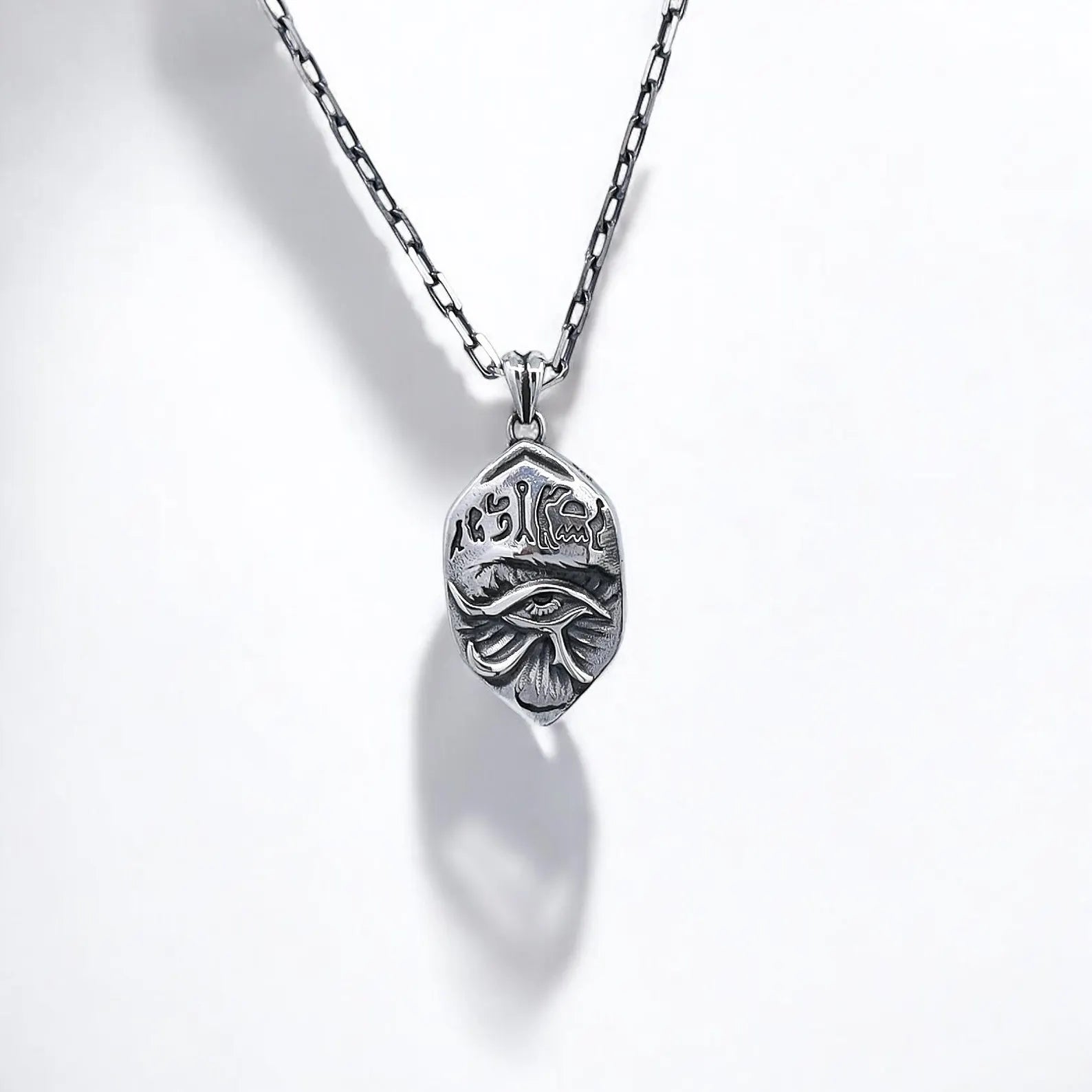 Handcrafted sterling silver Horus Eye pendant inspired by ancient Egyptian mythology, symbolizing protection, healing, and inner strength. This symbolic necklace is meticulously designed with detailed etching, perfect for men or women who value mystical jewelry with spiritual meaning and want to embrace a unique, powerful style.