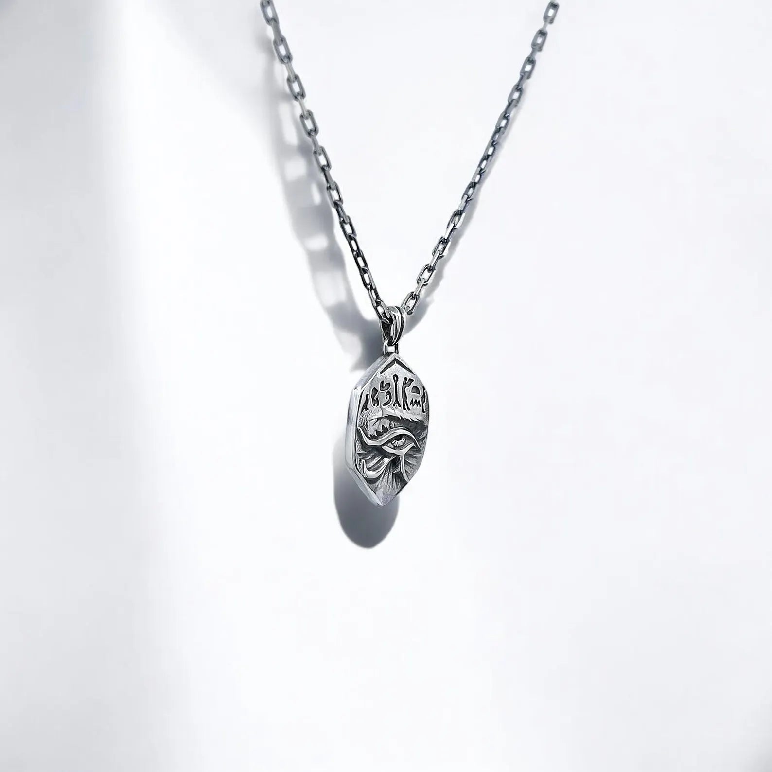 Close-up of the pendant’s back, showing the customizable engraving area where you can add initials, special dates, or a personal symbol. Transform this Horus Eye necklace into a unique and spiritual heirloom, making it a meaningful keepsake for those who value alternative jewelry and personalized pieces.