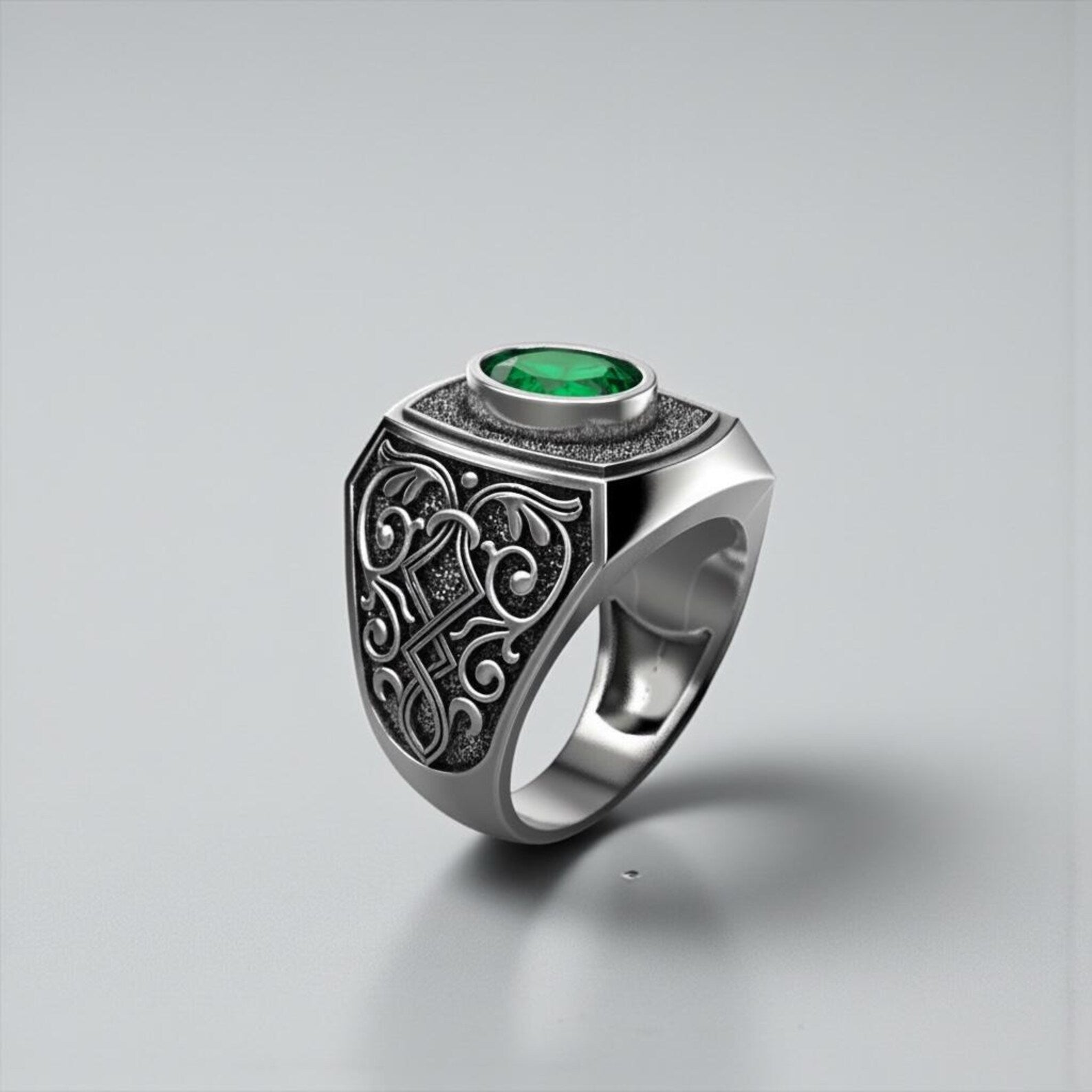 Victorian inspired emerald gemstone ring for men featuring a deep green emerald set in handcrafted sterling silver