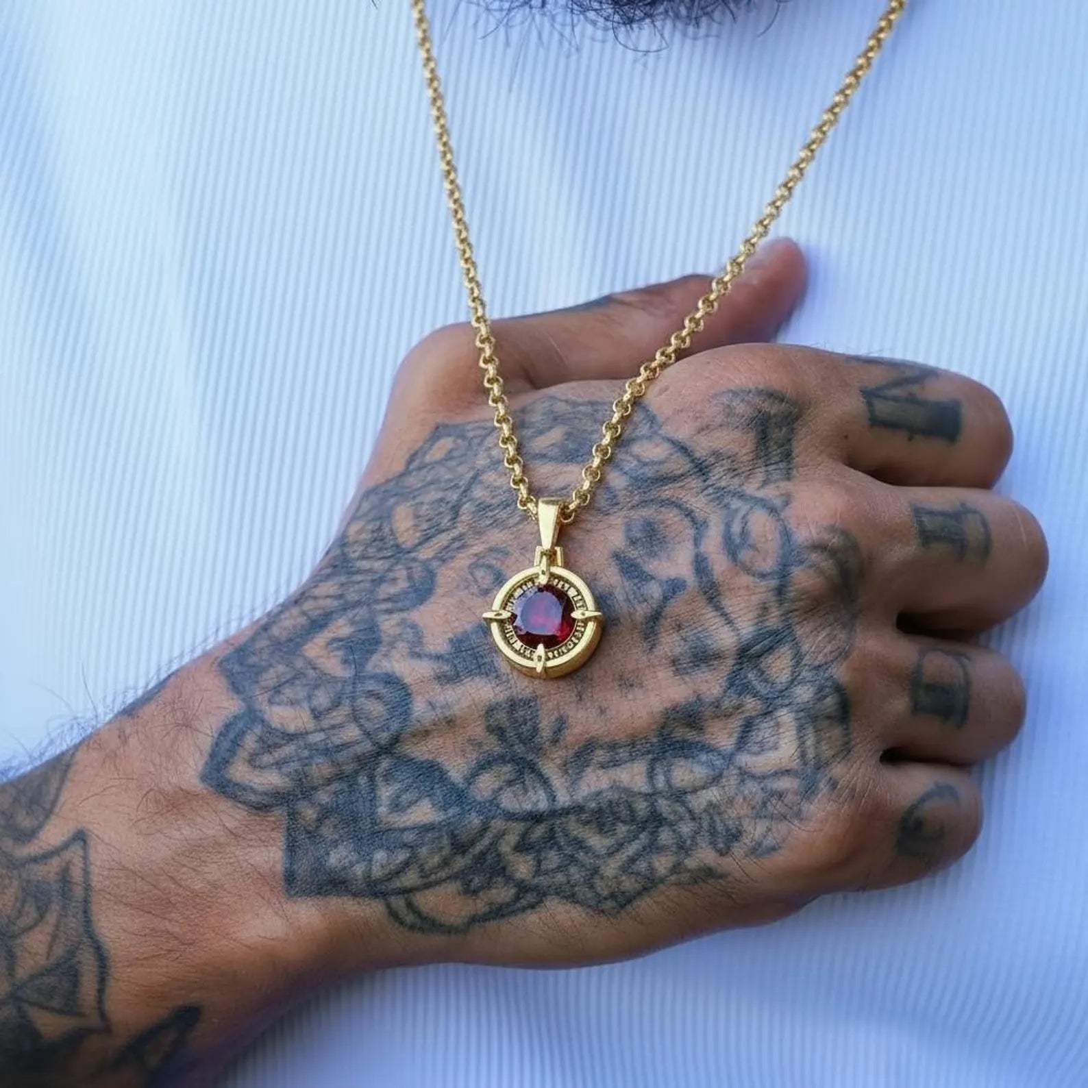 Custom compass necklace with garnet birthstone on gold plated sterling silver, personalized engraving option for name or date.