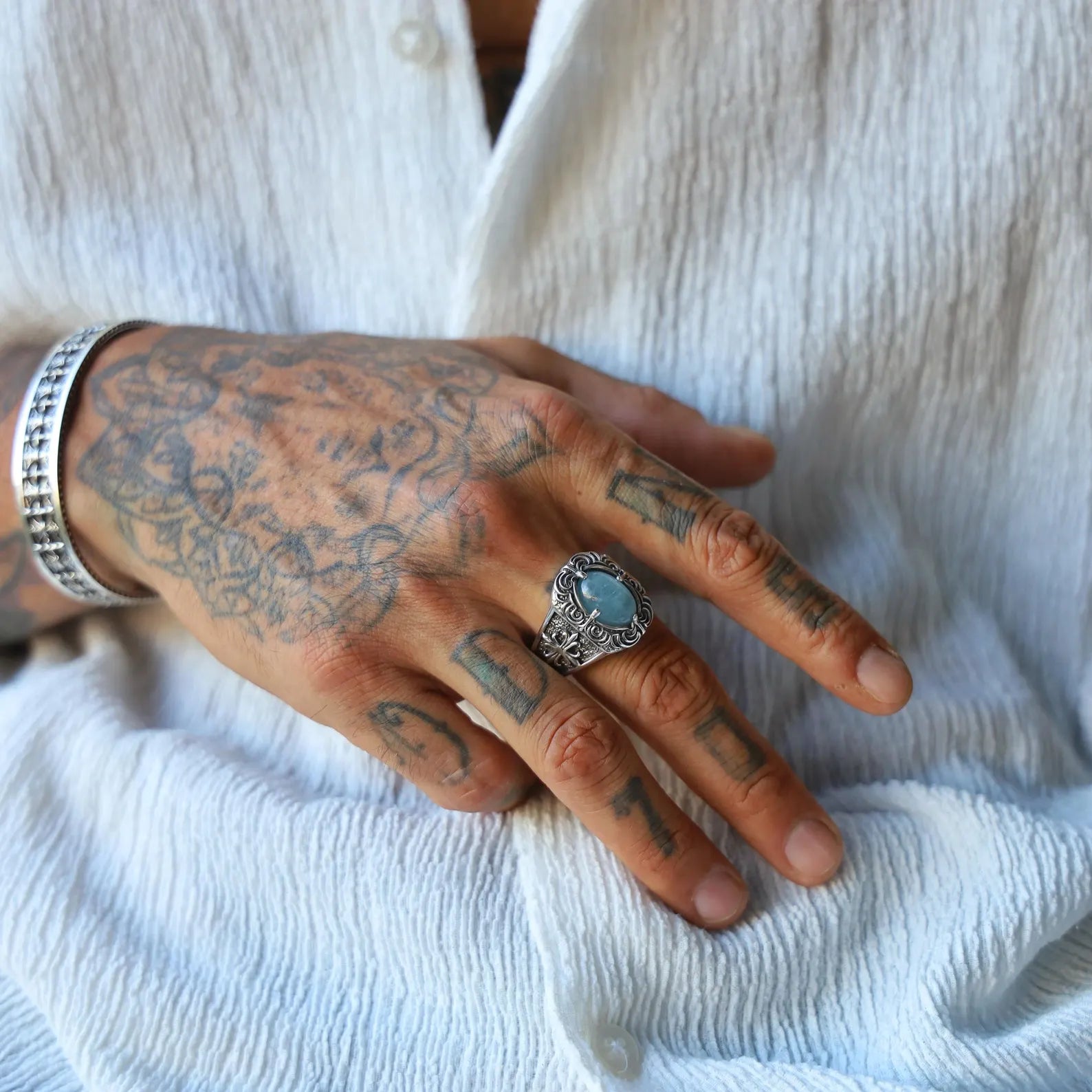 Mens aquamarine ring crafted in solid 925 sterling silver, blending gothic and medieval design elements. Intricate patterns and a striking blue stone make this ring a perfect gift for fantasy, biker, and alternative fashion fans. Elegant yet bold, this handmade piece stands out in any jewelry collection.