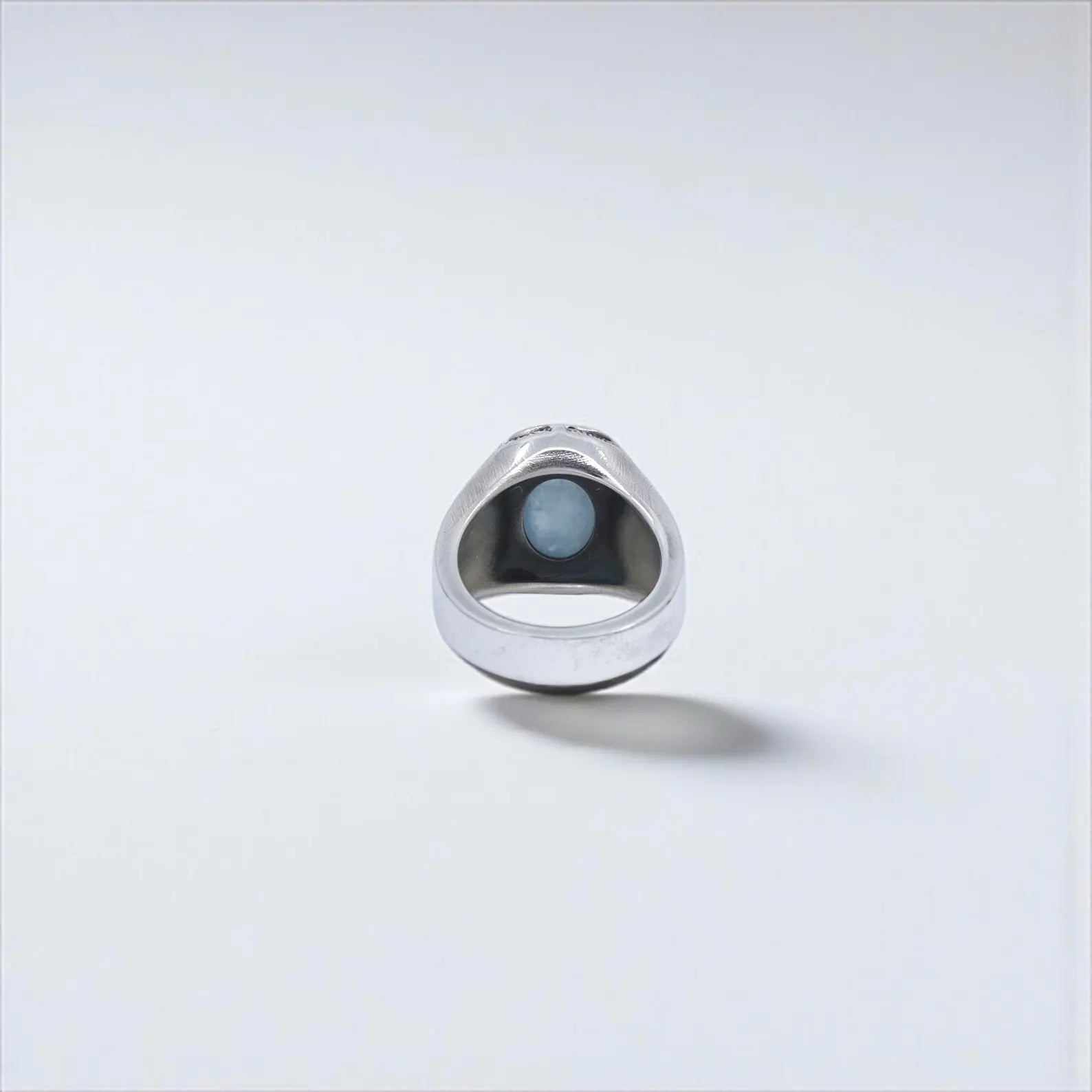 Bold and timeless, this aquamarine men's ring captures the essence of medieval and gothic craftsmanship. Sterling silver band with detailed engravings and symbolic cross accents make it a perfect alternative ring for stylish men. Great for Shopify listings and Google image search optimization.