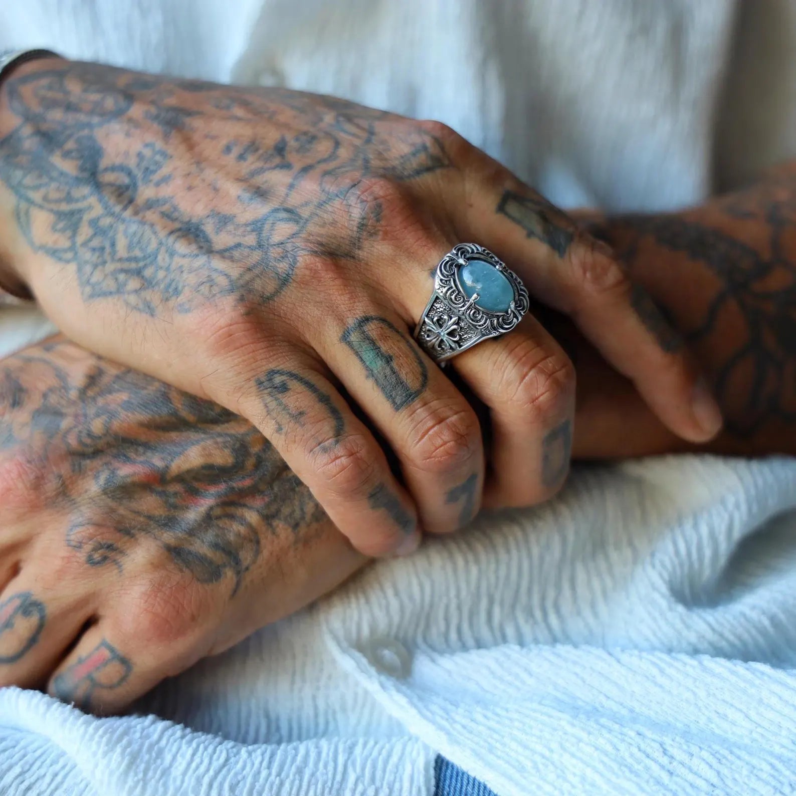 This sterling silver ring with an aquamarine cabochon is a handcrafted gothic accessory perfect for birthdays, anniversaries, or unique men's fashion. Features medieval-inspired scrollwork and symbolic detailing. Optimized for Shopify and Google search visibility under men's gemstone rings.