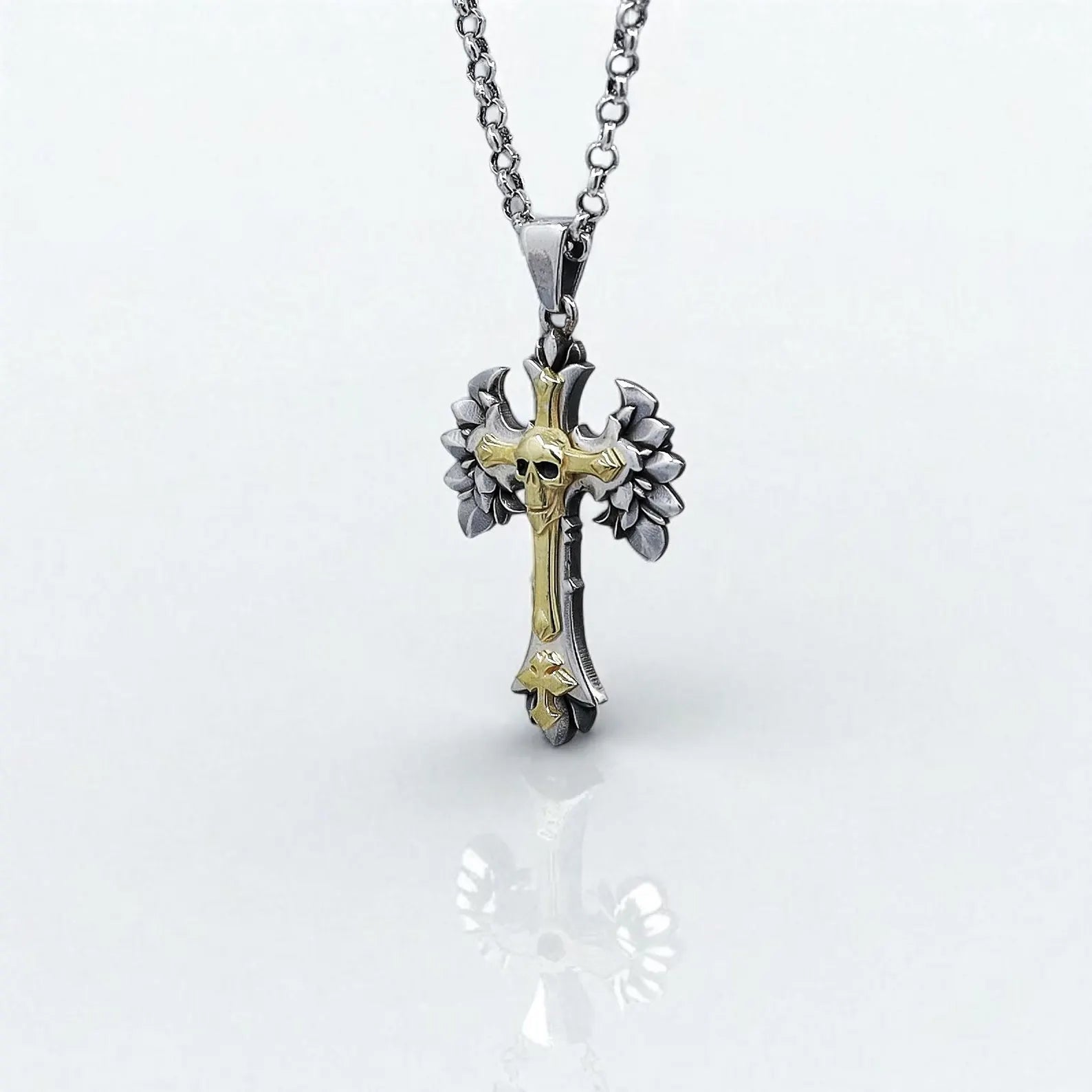 Men’s gothic skull cross necklace designed with fine sterling silver and accented with gold-plated details. The cross features sharp wings and a central skull, making it an ideal accessory for gothic, biker, or metal-inspired looks. Great as a timeless gift for men who seek bold and meaningful handmade jewelry.