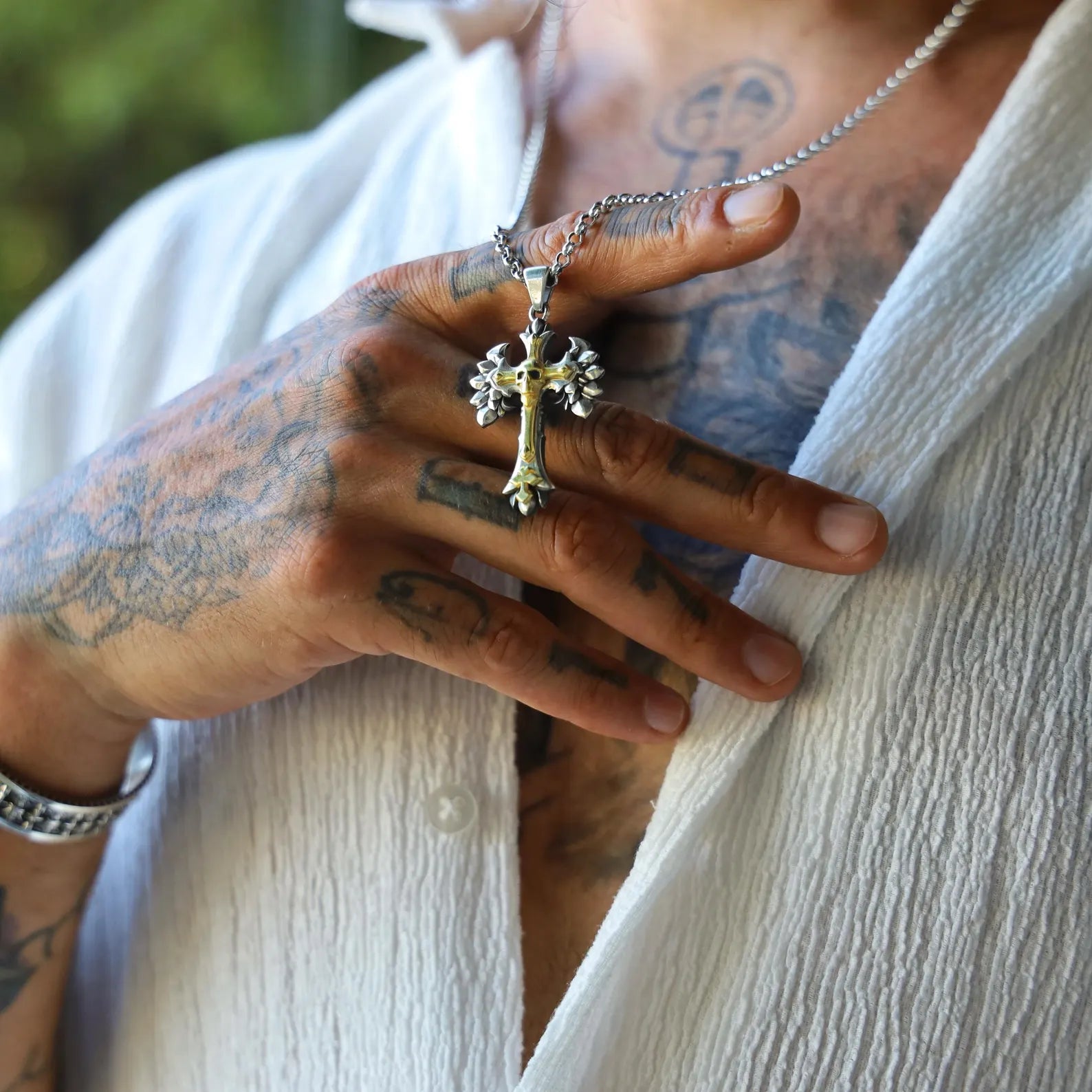 Close-up of handcrafted Gothic Skull Cross Necklace in silver and gold finish, showcasing a fearlessly elegant design. The skull on the cross adds deep symbolic meaning, representing mortality, power, and transformation. A premium piece of jewelry for those who embrace individuality, mystery, and bold statement pieces.