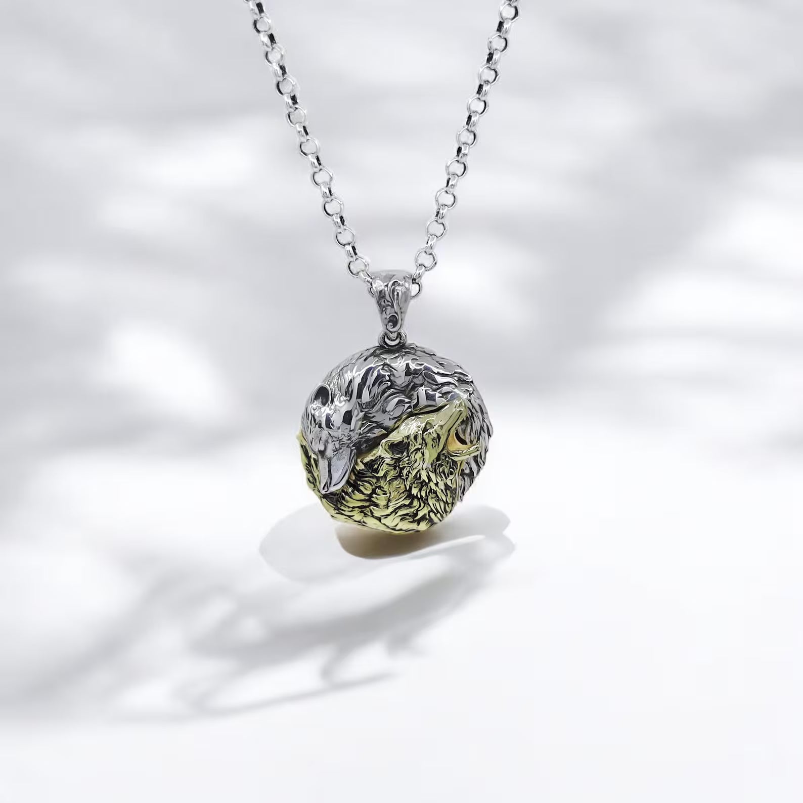 Handcrafted Silver Yin Yang Wolf Necklace featuring a dual-tone design with sterling silver and 14k gold plating. This symbolic pendant captures the spirit of balance and duality, with two intertwined wolves representing calmness and power. A powerful unisex necklace ideal for nature lovers, spiritual souls, and those seeking harmony. Perfect for gifting or personal wear.