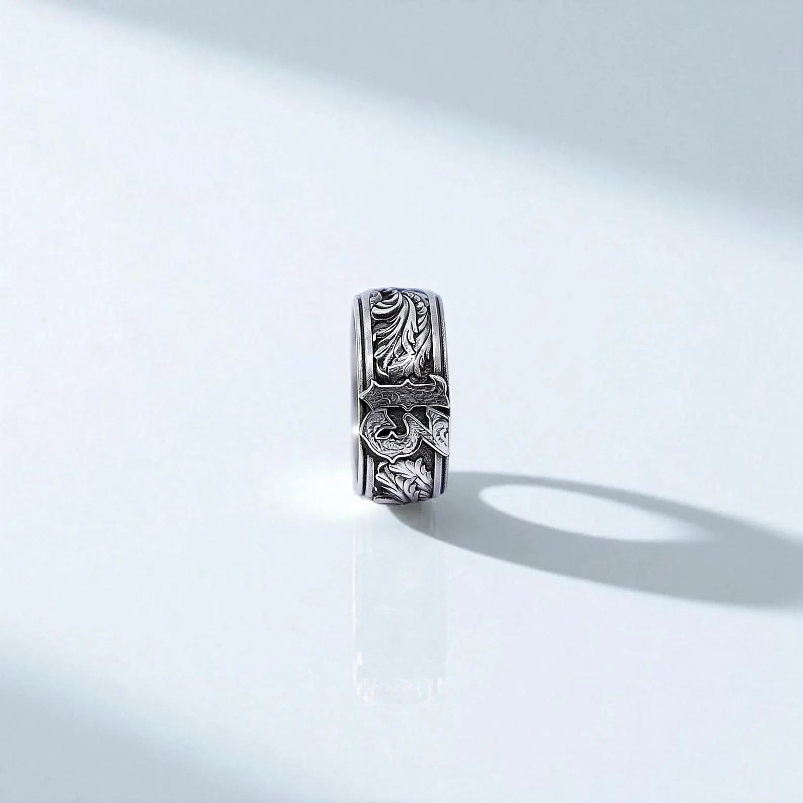 Gothic-style ring for men featuring the number 13 on a wide sterling silver band. The design includes textured leaves and vintage scrollwork, giving it a bold, handcrafted feel. A timeless and edgy accessory for bikers, metalheads, or fans of tattoo-inspired jewelry.