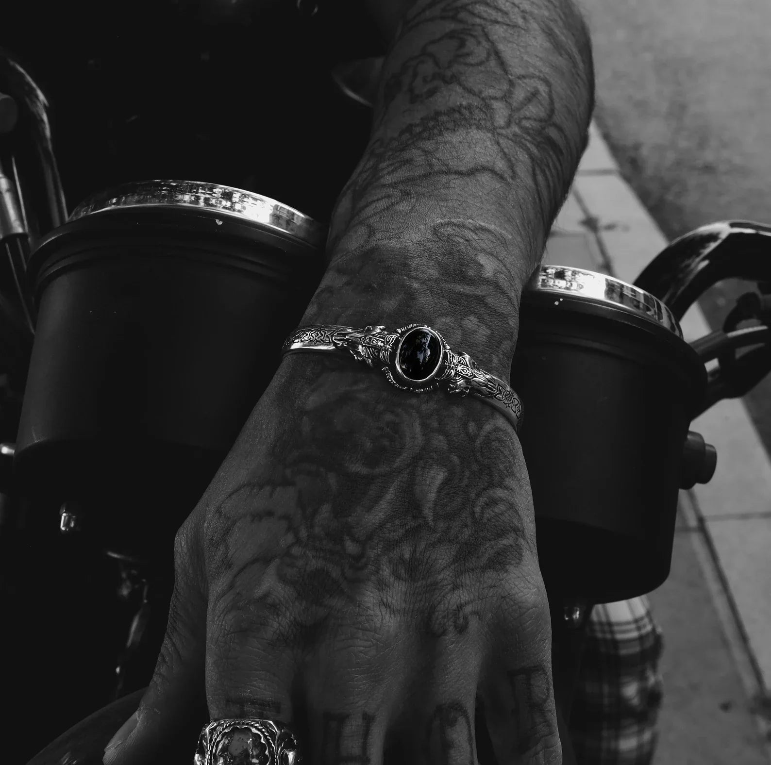 Modern meets myth in this artisan-crafted men’s onyx cuff bracelet. With a design inspired by Norse warriors and handcrafted from 925K silver, it delivers gothic flair, fantasy charm, and a strong visual statement, making it a must-have for lovers of symbolic mens jewelry.