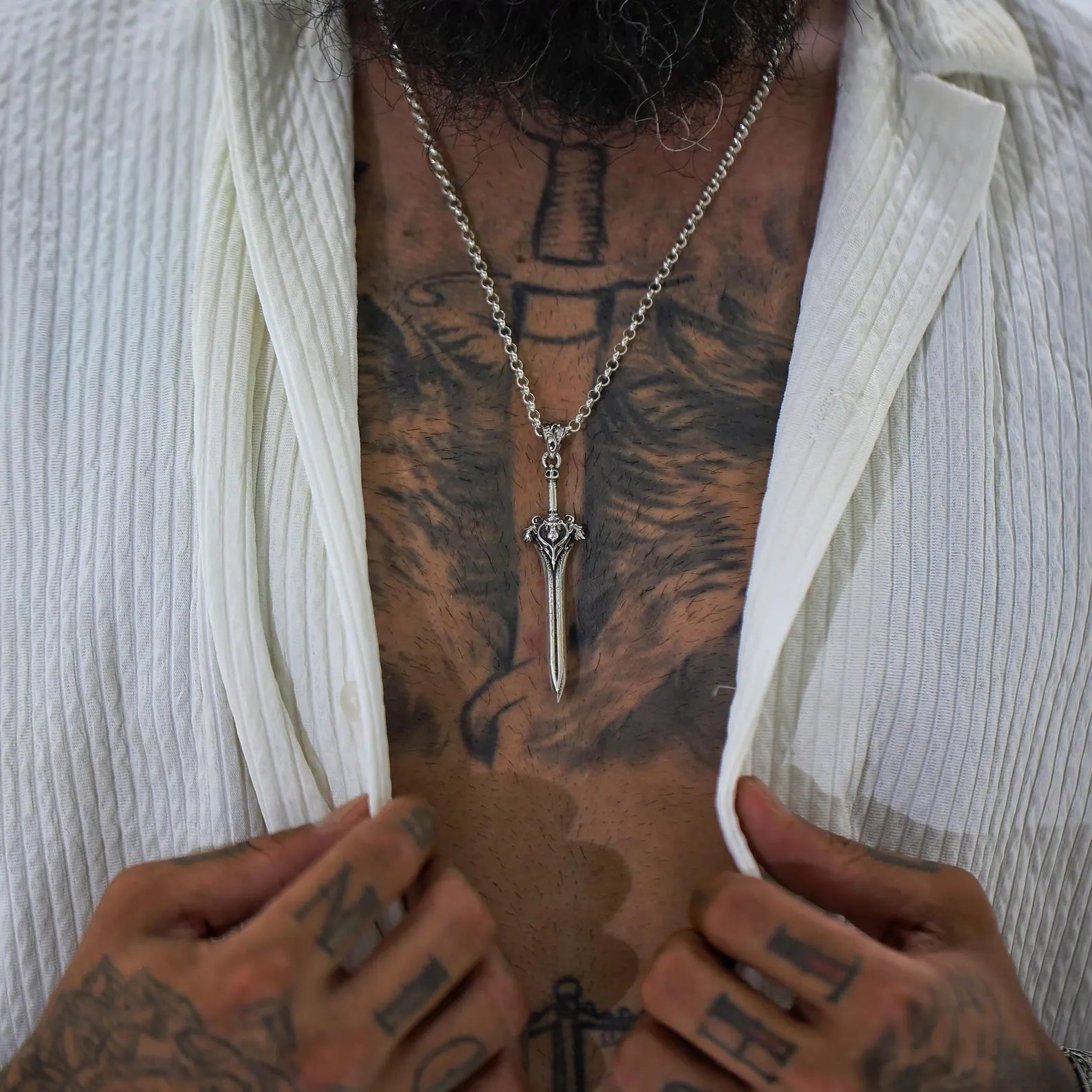 A one-of-a-kind sterling silver necklace featuring a detailed medieval sword design and leon head symbol. Gothic, elegant, and fierce — this piece is ideal for collectors of warrior jewelry or personalized masculine accessories.