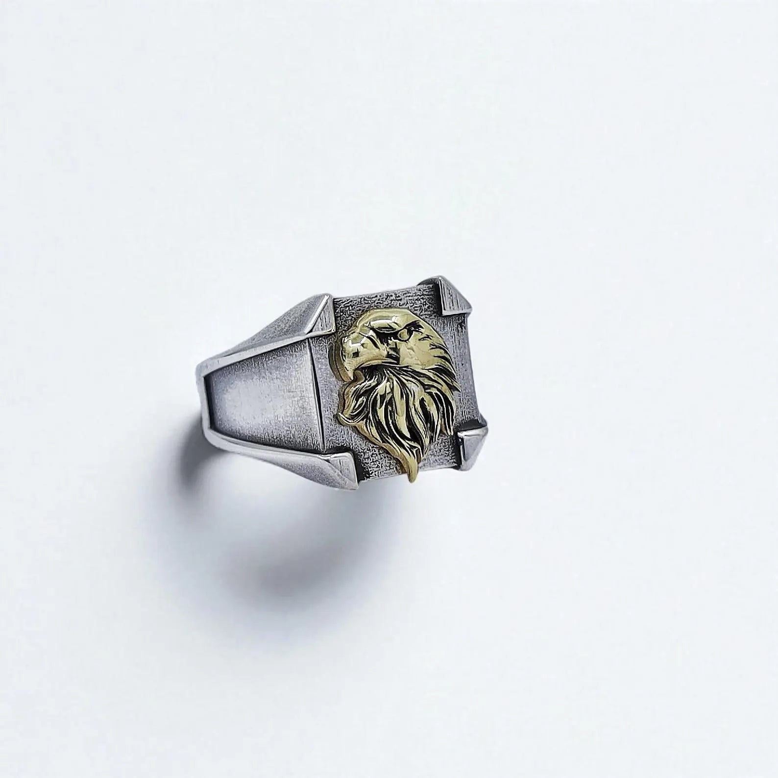 Handcrafted sterling silver pinky ring for men featuring a bold, three-dimensional gold-plated American bald eagle design, symbolizing strength, freedom, and patriotism — perfect for veterans, bikers, or statement jewelry lovers.