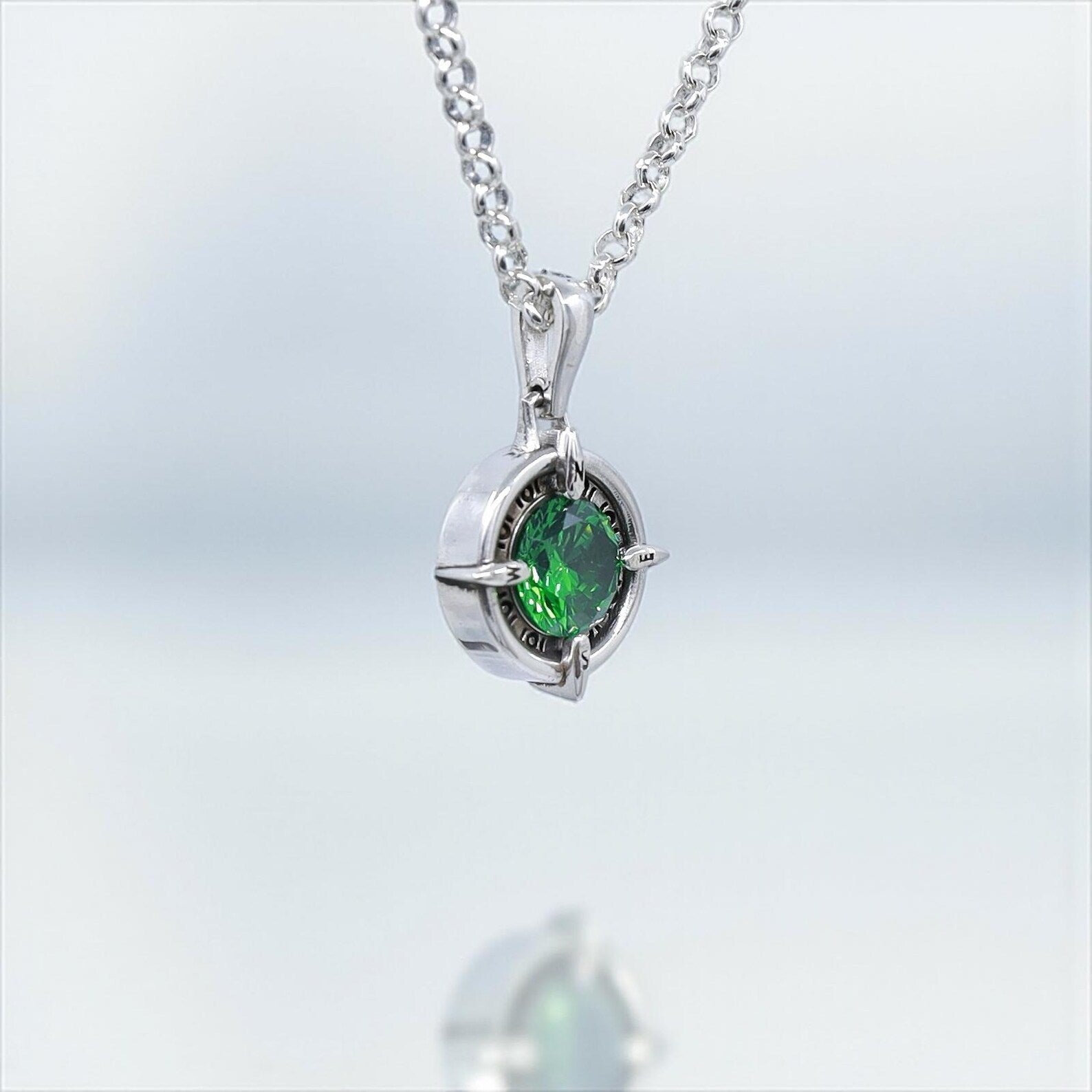 Elegant compass necklace handmade in sterling silver with a sparkling emerald green gemstone. This unique nautical pendant symbolizes direction and adventure, making it a perfect jewelry gift for him or her. Ideal March or May birthstone-inspired gift for travelers and ocean lovers who appreciate artisan jewelry.