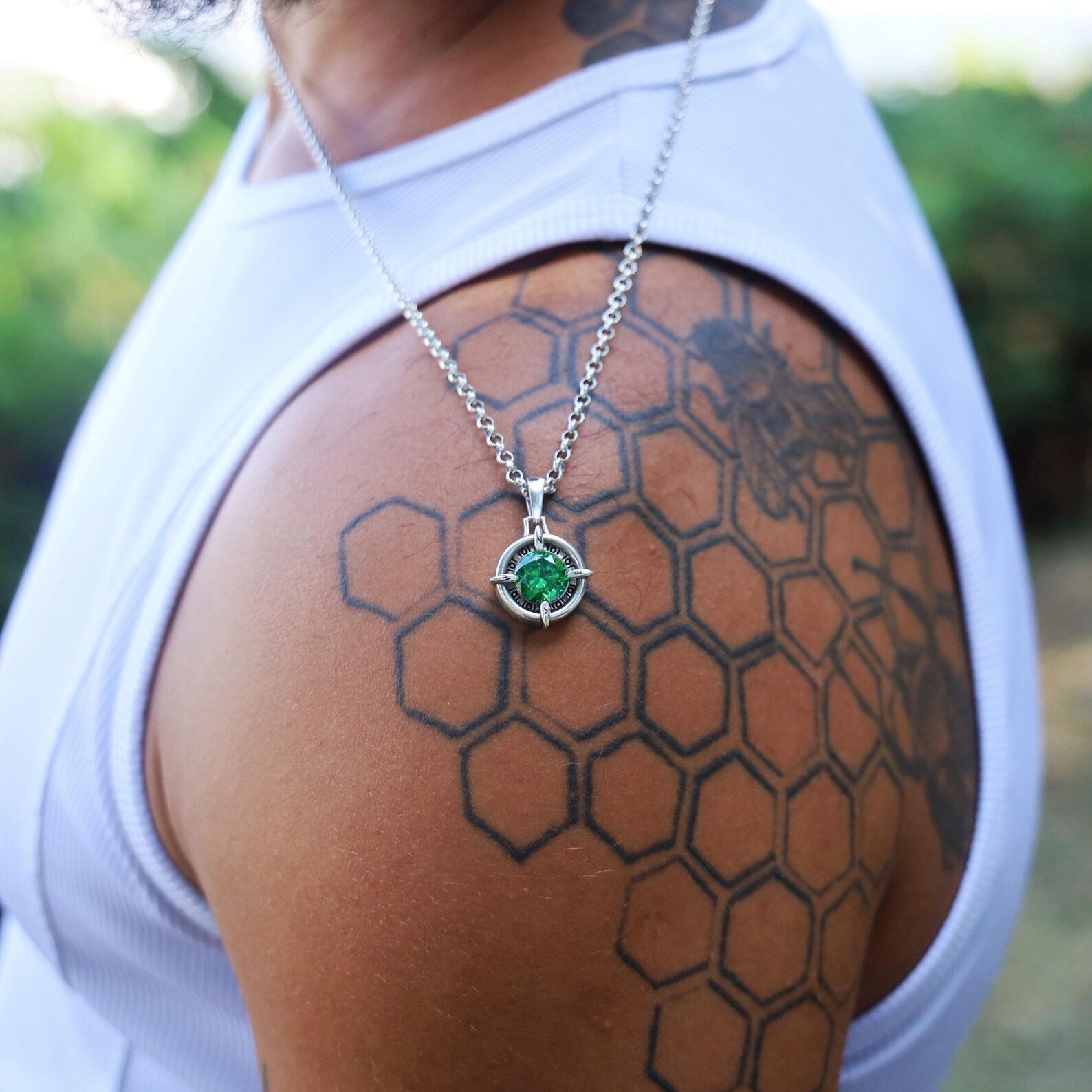 Nautical compass pendant handcrafted in sterling silver, highlighted with a brilliant emerald green gemstone. This handmade necklace represents guidance, safe journeys, and adventure. A meaningful jewelry gift for explorers, sailors, and dreamers. Perfect gift idea for birthdays, graduations, or special occasions celebrating life’s journeys.