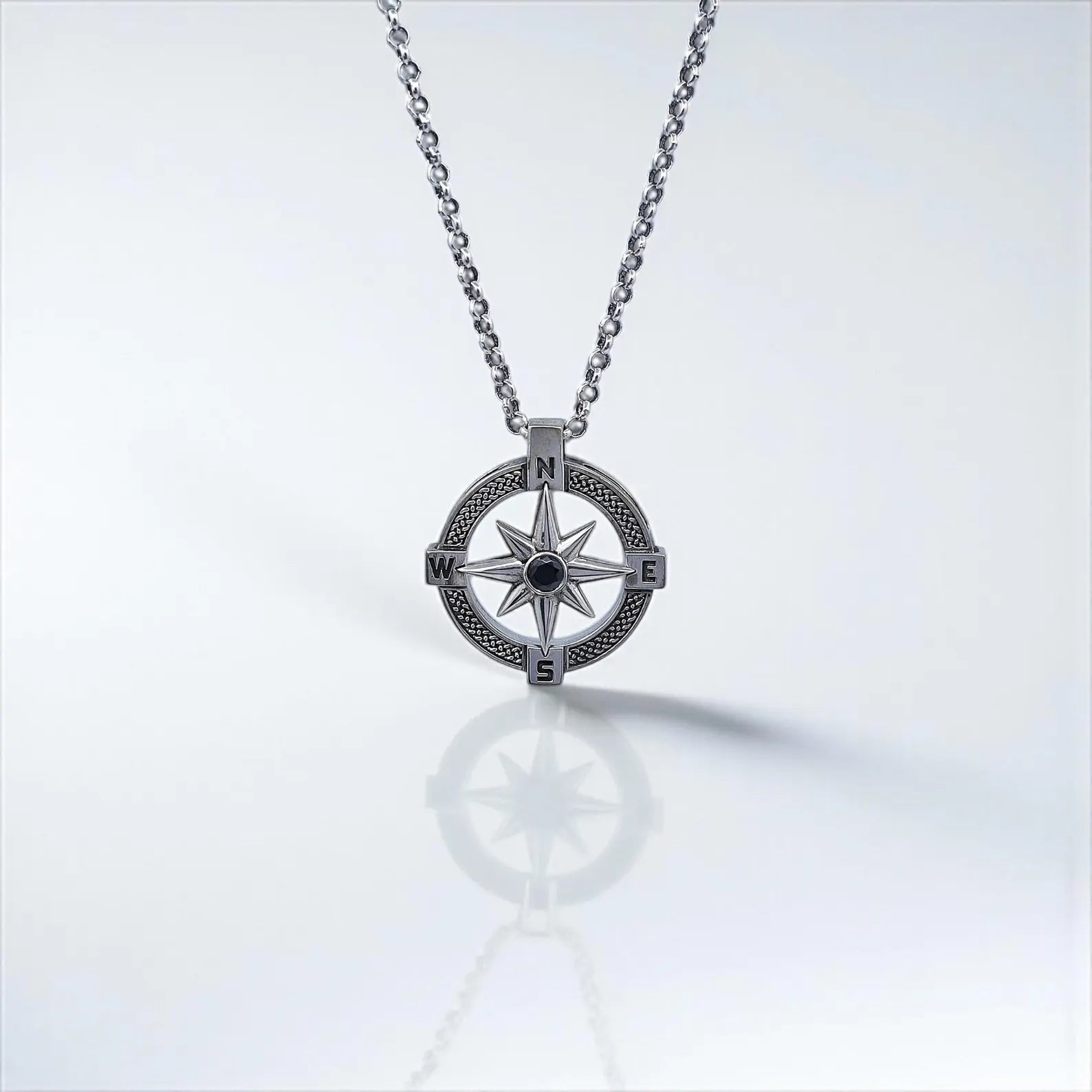 Unisex sterling silver compass pendant necklace with a symbolic North Star design, handmade for timeless elegance. This nautical jewelry piece represents protection and direction, making it an ideal gift for men or women. A unique sterling silver accessory perfect for anniversaries, birthdays, graduations, or as a travel-inspired jewelry piece.