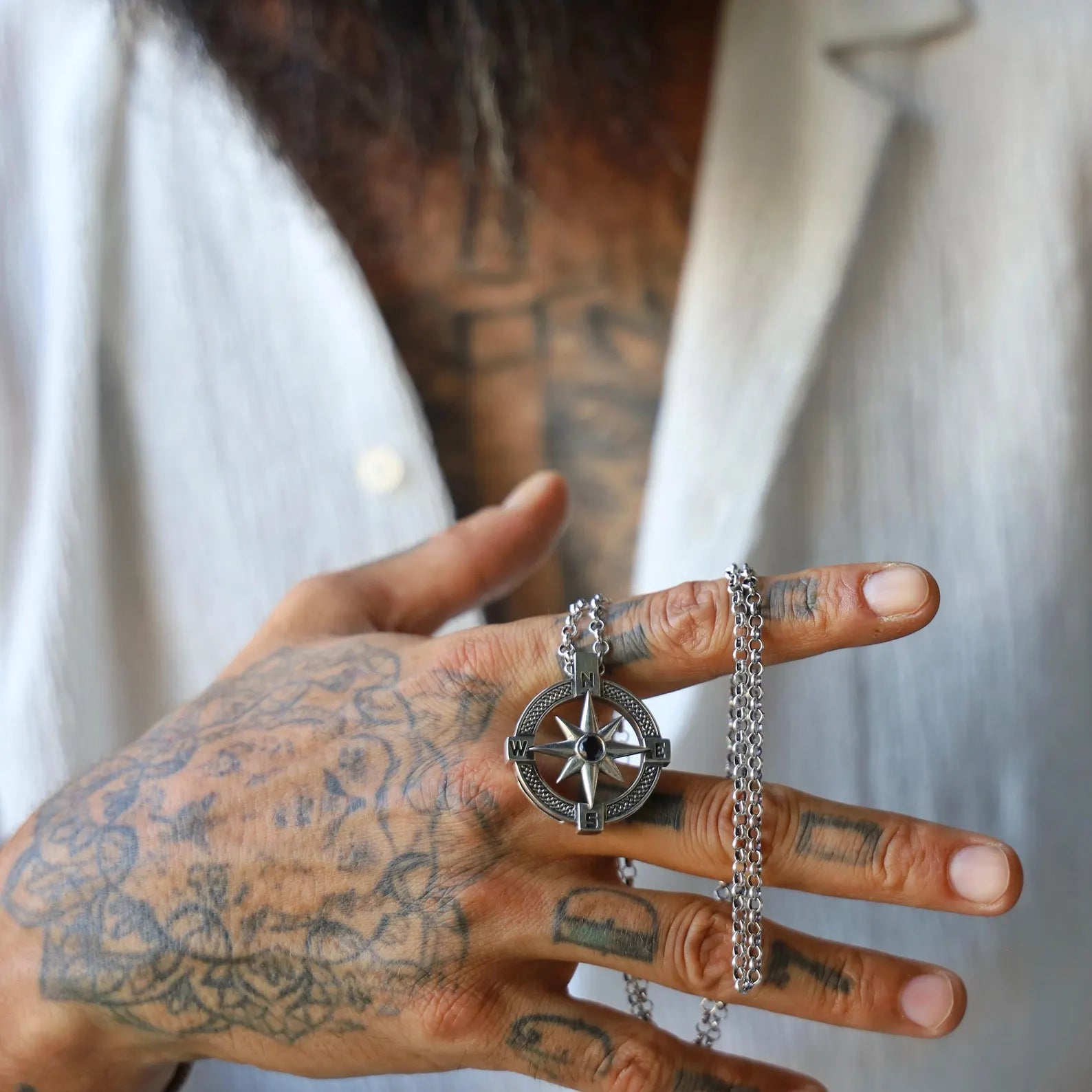 Sterling silver unisex compass necklace with a handcrafted North Star pendant, inspired by nautical and celestial themes. This timeless jewelry symbolizes guidance and hope, making it a thoughtful gift for him or her. Perfect for travelers, adventurers, or those seeking symbolic jewelry to wear daily or on special occasions.