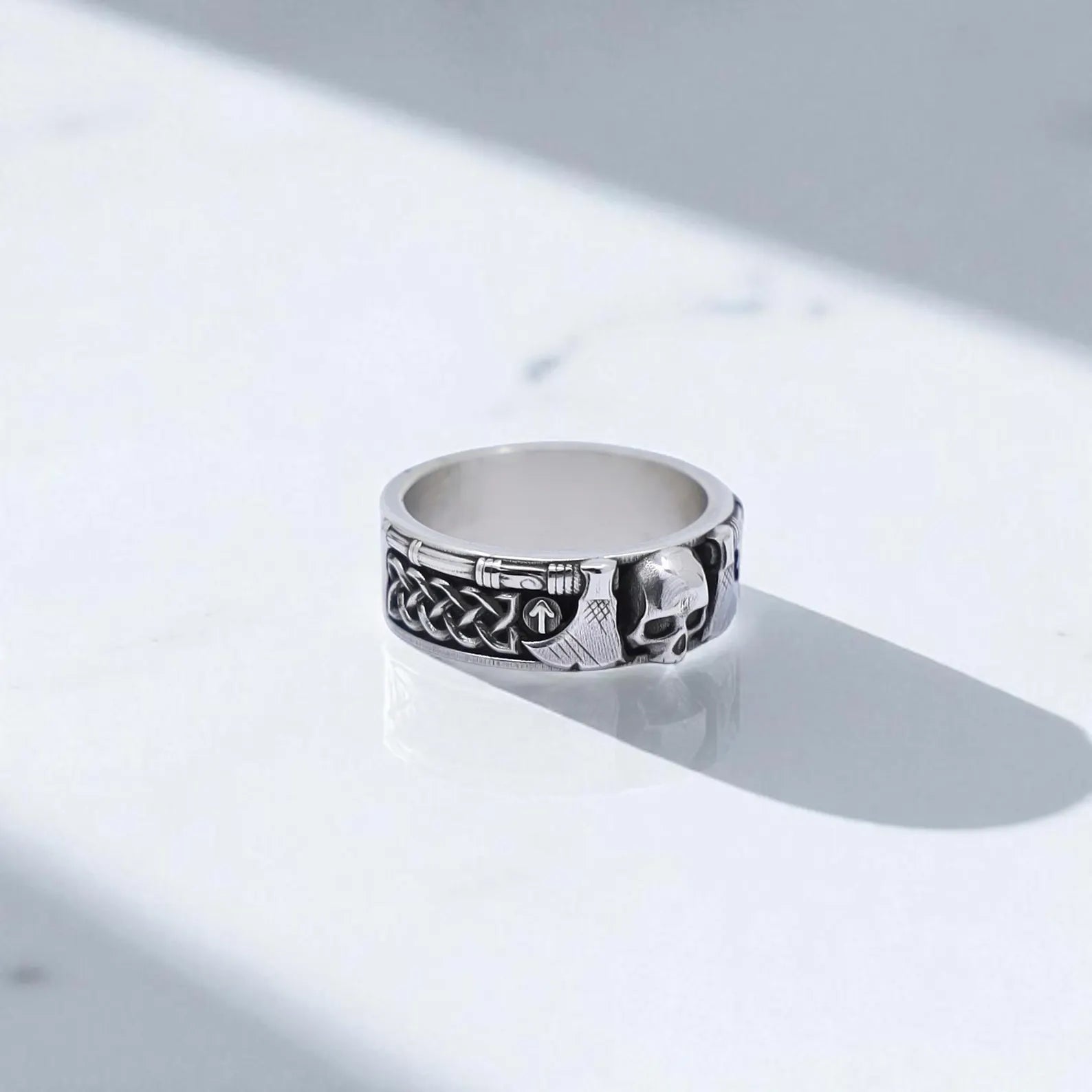 Handcrafted Viking skull ring made from solid 925 sterling silver, featuring Norse axe details and ancient knotwork engravings. This bold men's jewelry piece represents strength, bravery, and warrior spirit. Perfect for fans of Nordic mythology, gothic fashion, or unique handcrafted rings with symbolic power. An ideal gift for him on birthdays, anniversaries, or Father’s Day.