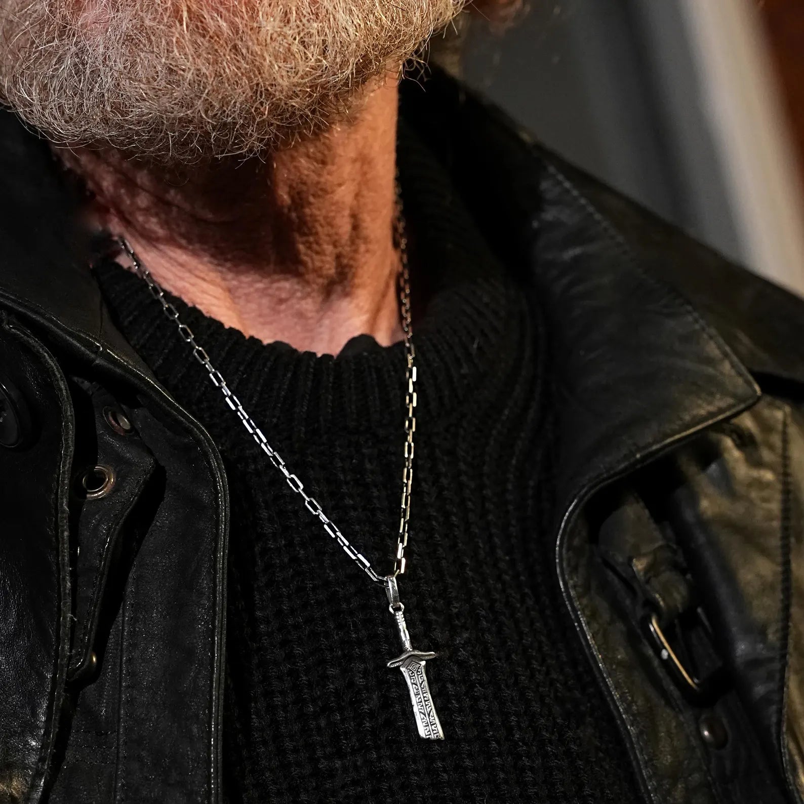 Detailed view of a solid silver sword necklace with deep etching and aged finish, reflecting timeless Viking and knightly inspiration perfect for those who admire fantasy, mythology, and handcrafted jewelry with meaning.