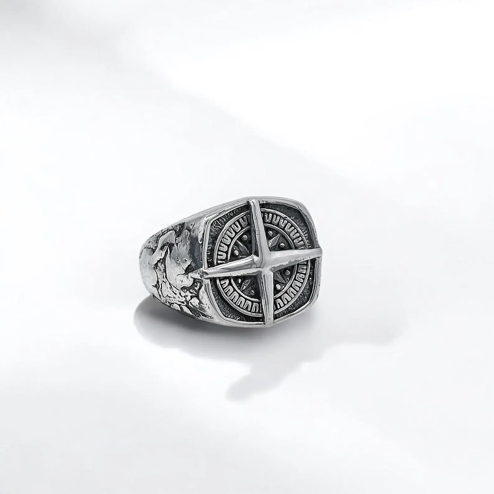 Close-up of a men’s silver North Star compass ring handcrafted with precision, showcasing the intricate engraving of the compass rose. Crafted from high-quality 925 sterling silver, this unique ring stands as a symbol of navigation and resilience, offering a bold and stylish addition to any biker, sailor, or nature enthusiast’s accessory collection.