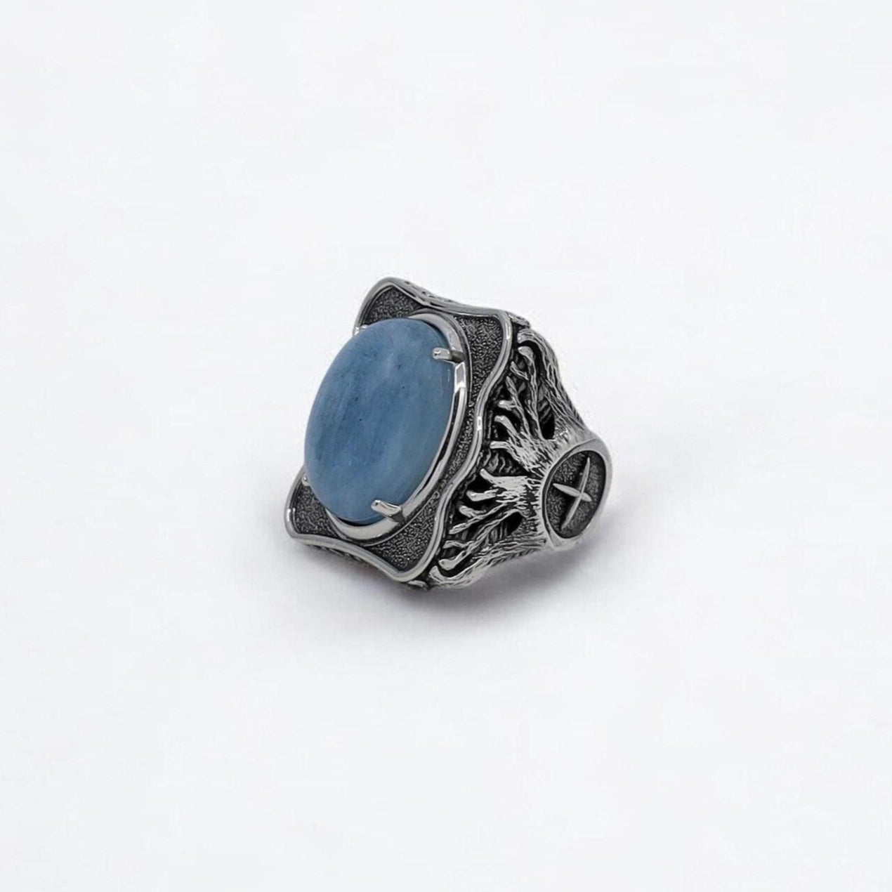 A handcrafted sterling silver aquamarine compass ring for men, featuring a bold nautical design with engraved north star details. This 925K statement piece blends ocean inspiration with symbolism and masculine style, making it a perfect gift for sea lovers, adventurers, or birthdays and anniversaries.