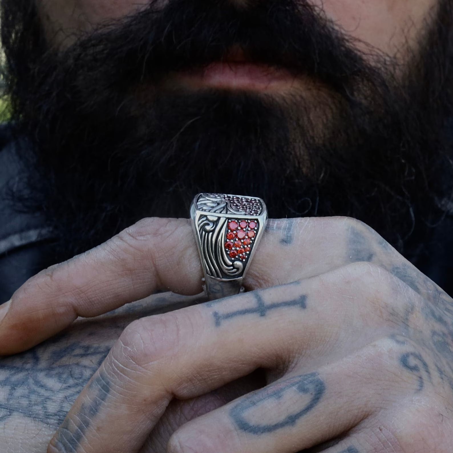 Lifestyle composition featuring the silver ocean wave ring worn with casual attire, capturing the bold yet elegant presence of the design. An excellent visual for keywords such as gift for him, birthday jewelry for men, and July birthstone accessories.