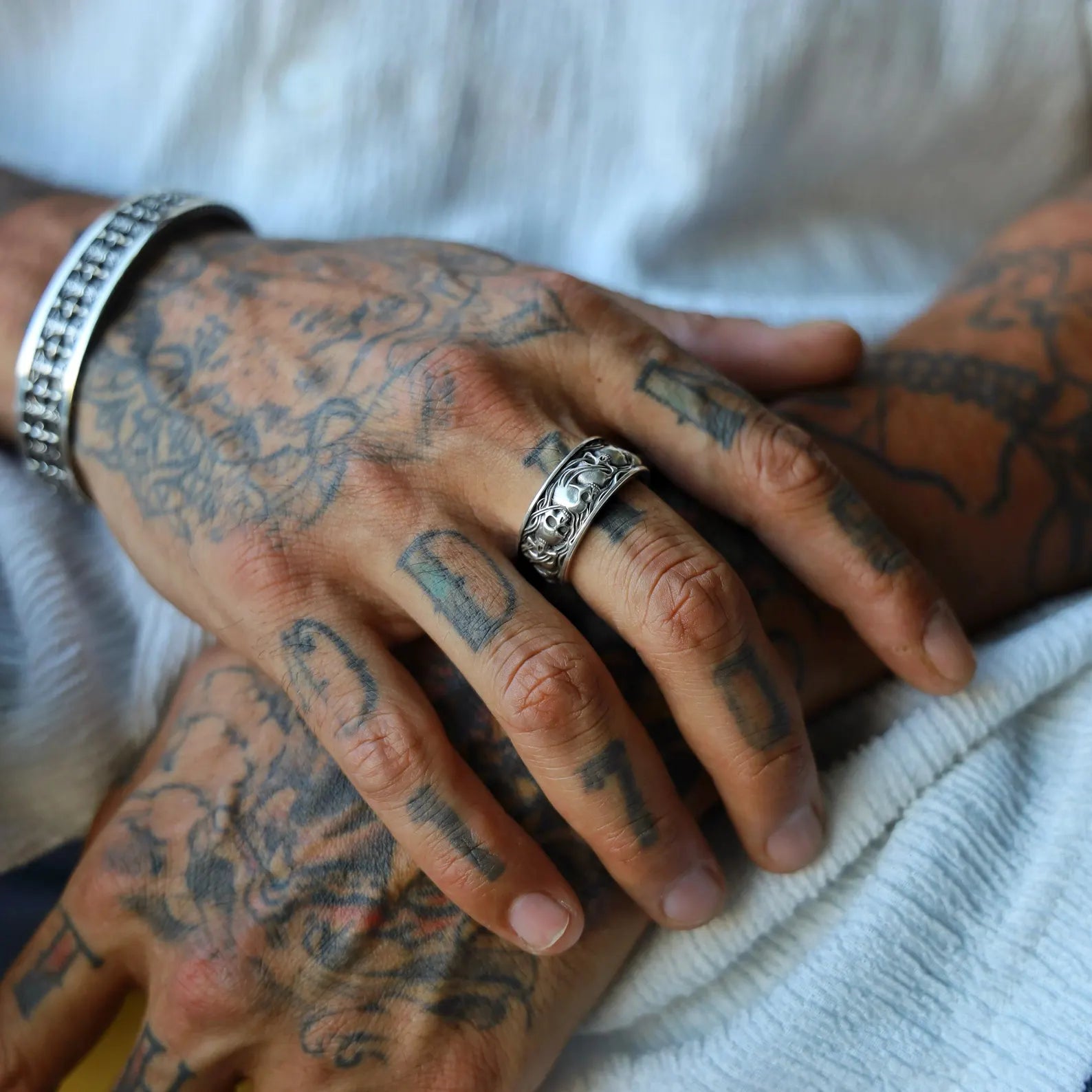 Bold and timeless, this men’s skull band ring features a handcrafted design with engraved skeletal details throughout the wide silver shank. Made from pure sterling silver with a dark oxidized patina, it reflects gothic themes of power and legacy. A striking gift idea for boyfriends, husbands, or gothic jewelry collectors.