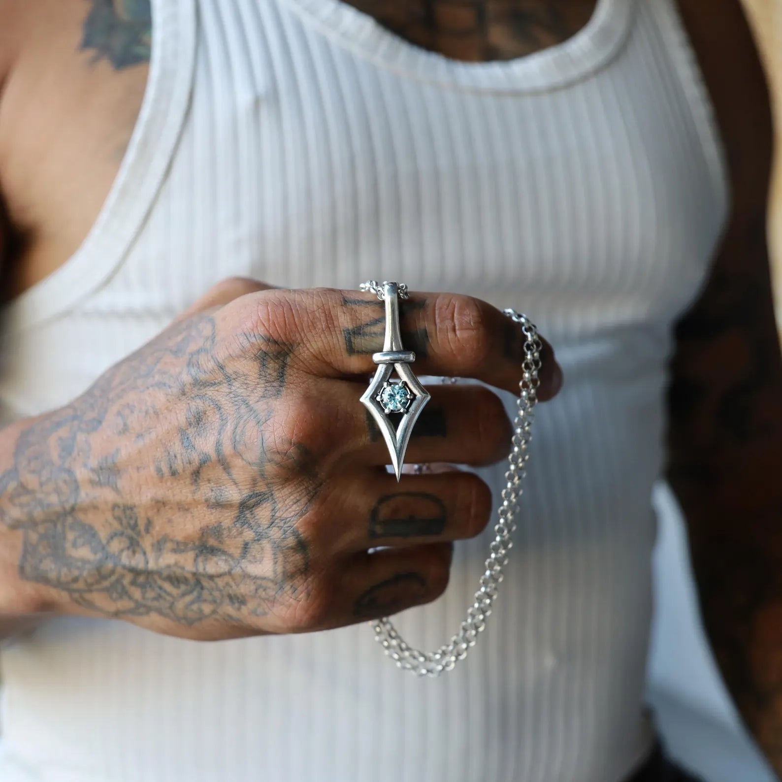 Minimalist aquamarine pendant necklace handmade in sterling silver with a gothic-inspired design. This artisan piece captures elegance and individuality, making it perfect for women who love unique gemstone jewelry. A meaningful March birthstone gift for her on birthdays, holidays, or romantic occasions.