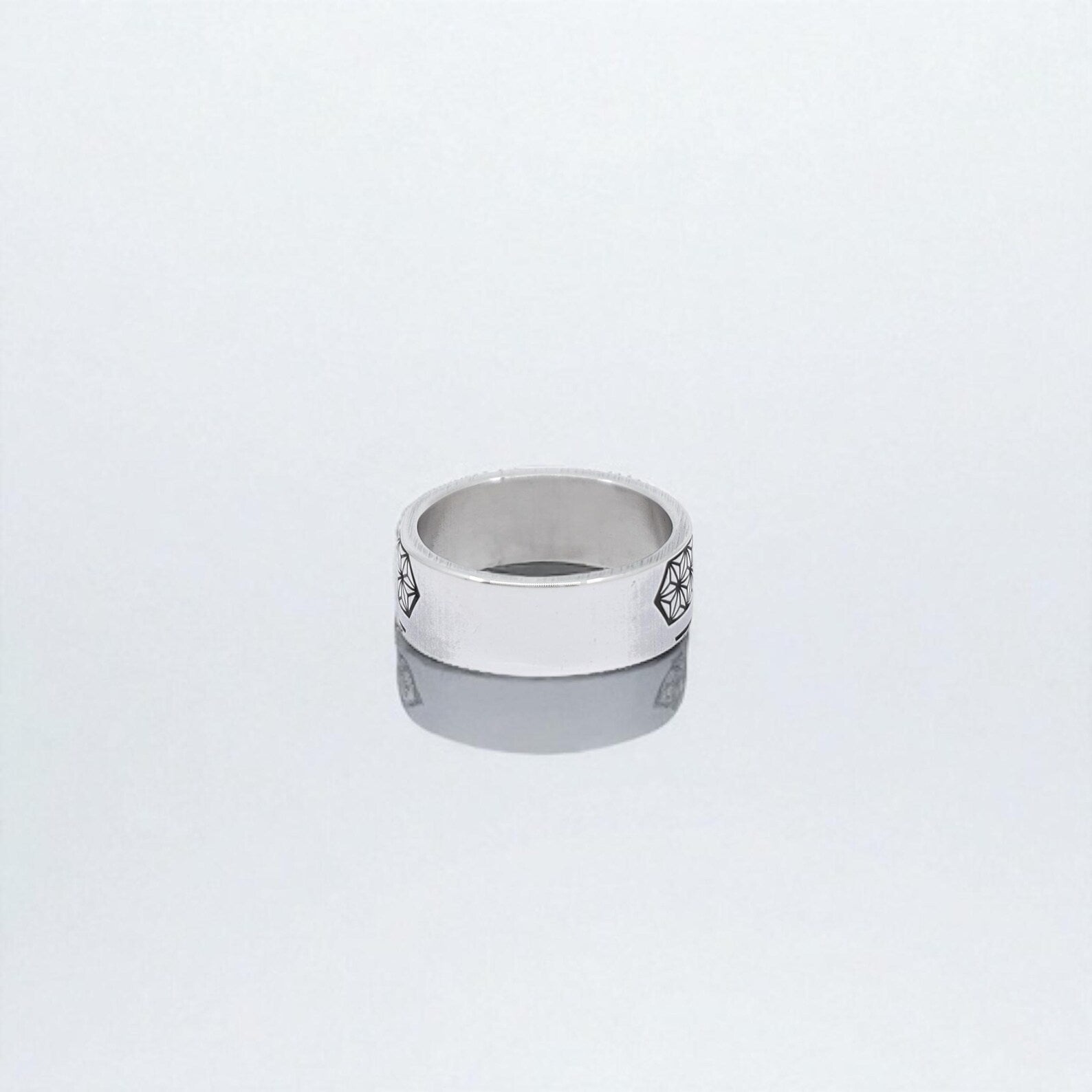 Close-up of a handmade Norse Valknut ring crafted from high-quality sterling silver, inspired by Viking geometry and myth. The Valknut symbol, often linked to Odin, serves as a talisman for courage and wisdom. A powerful accessory for history lovers, Viking fans, or anyone drawn to ancient sacred symbols.