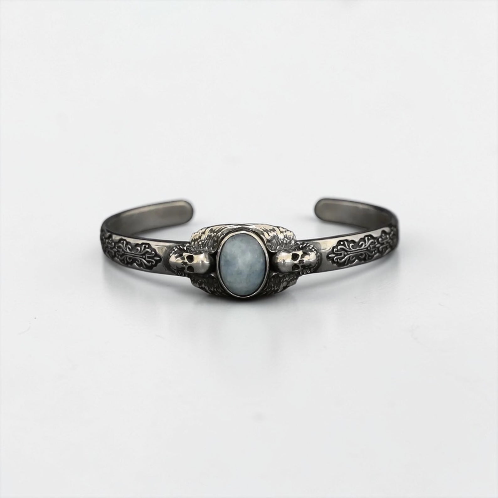 Elevate your edgy style with this handcrafted sterling silver aquamarine bracelet featuring a striking gothic skull charm. This bold statement bracelet combines the natural power of aquamarine with the dark, alternative style of gothic jewelry, making it a unique and meaningful piece for men who love to stand out. Crafted with precision and attention to detail, this spiritual bracelet exudes rugged elegance and a connection to both the earth and your inner strength.