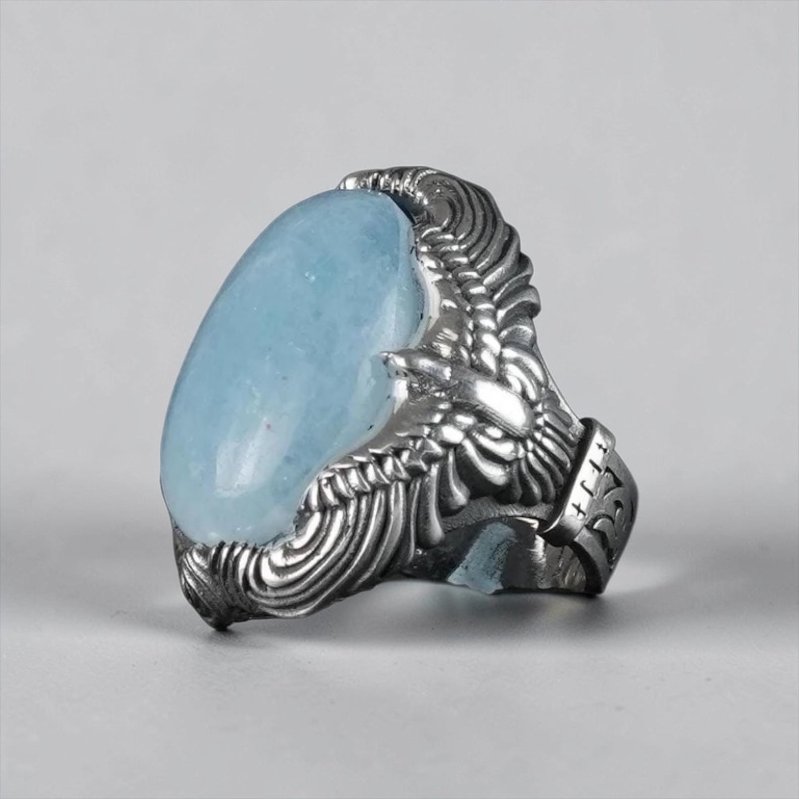 For those seeking a non-traditional engagement or promise ring, this handcrafted piece offers a unique alternative. The combination of aquamarine and an eagle design symbolizes peace and commitment, perfect for couples who value individuality.