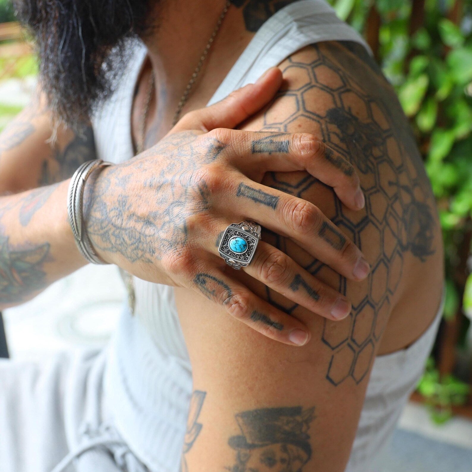 This turquoise and sterling silver statement ring features a square face and a deeply set gemstone that radiates protection and personal style. A spiritual talisman turned fashion accessory, perfect for layering or wearing alone.