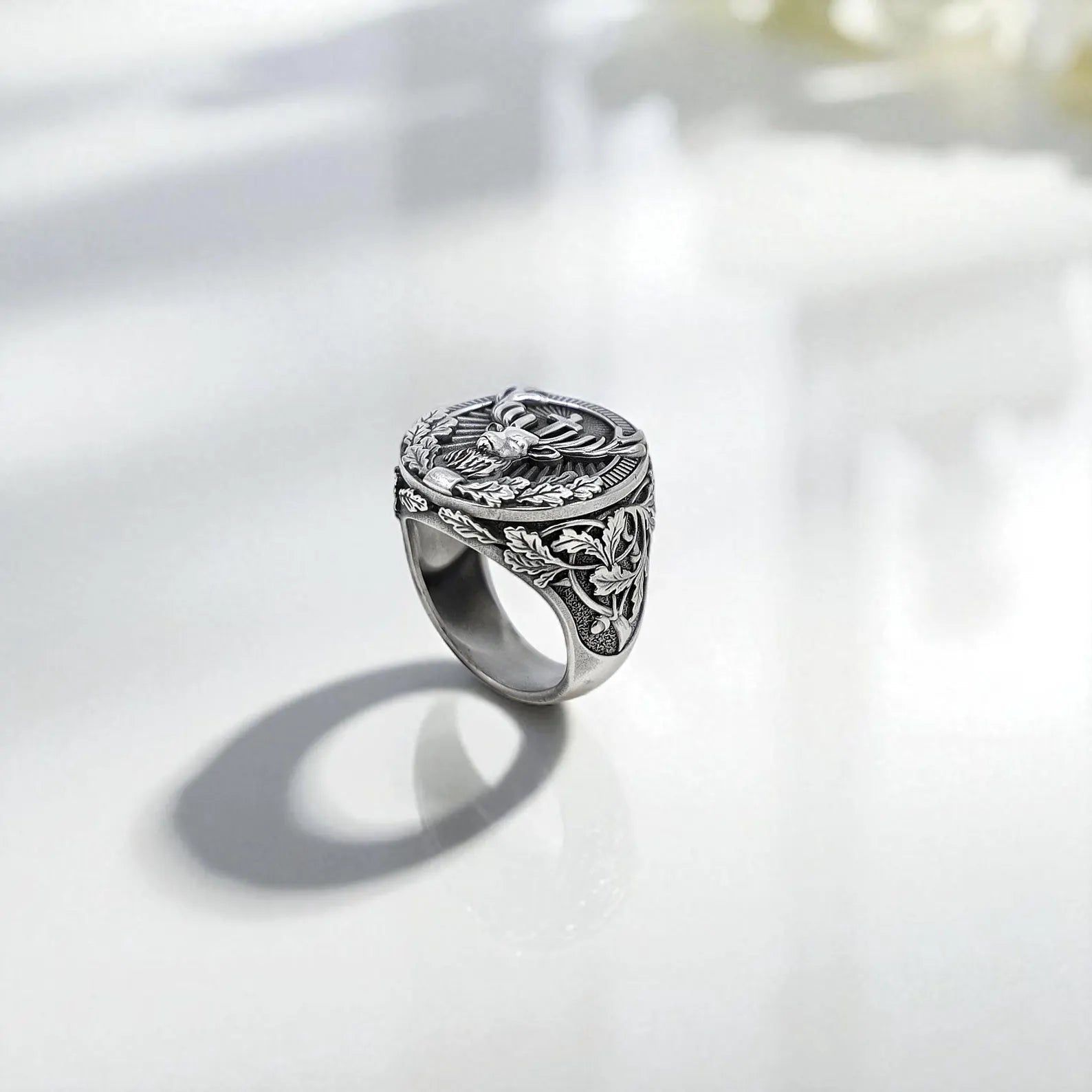 The artisanal quality of this men's ring is emphasized through its intricate leaf patterns and high-relief animal figure. The combination of gothic and rustic elements makes it a standout piece for fans of mythological or medieval jewelry.