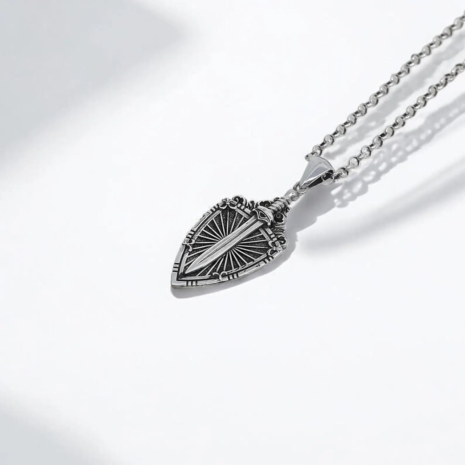 Sterling silver medieval pendant necklace with sword and shield design, symbolizing courage and honor. Perfect accessory for men’s gothic style, cosplay outfits, and knight-themed collections. Strong chain and detailed craftsmanship for long-lasting wear.